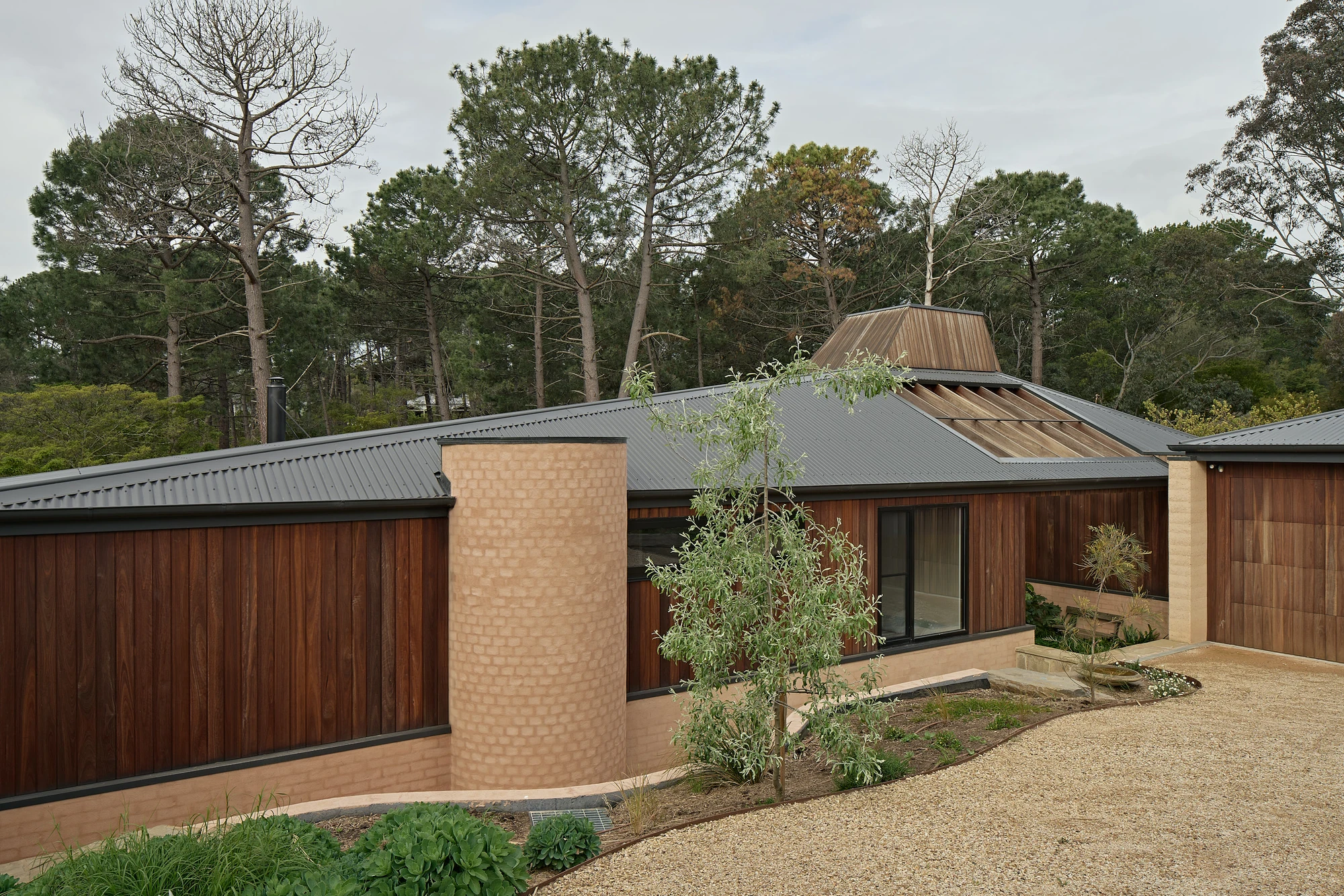 Homestead House by MRTN Architects — Homestead House presents a low-slung residential structure integrated into native bushland, its form reading as a deliberate response to the surrounding...