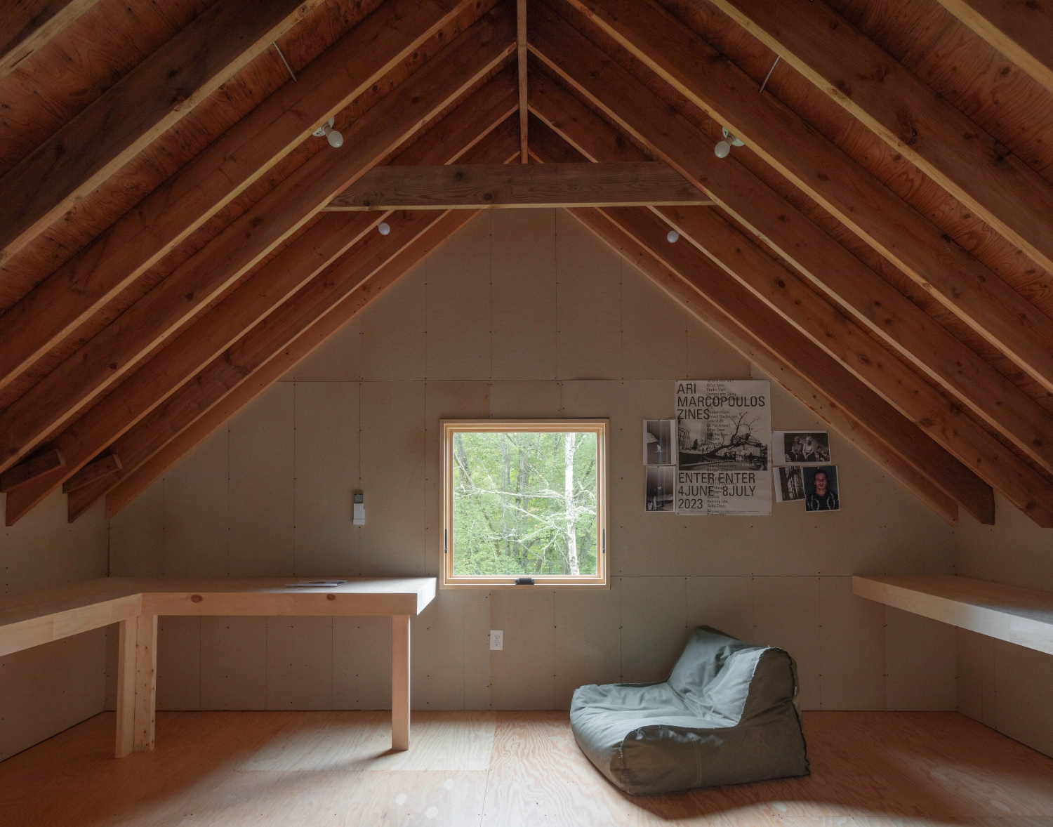 Studio Barn by Worrell Yeung — A gable-roofed timber-frame studio interior in Rhode Island, photographed from the threshold.