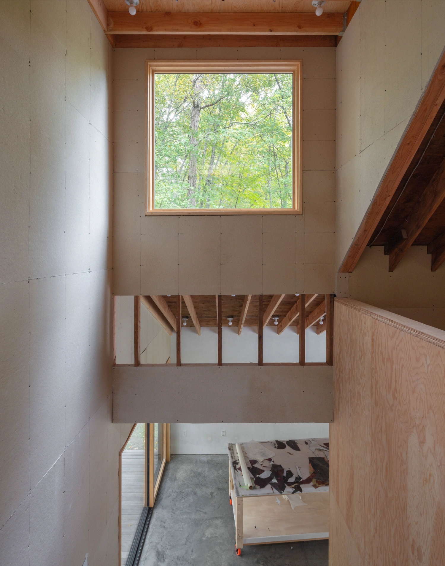 Studio Barn by Worrell Yeung — A multi-level interior view of Studio Barn reveals the building's vertical organization through a series of stacked spaces.