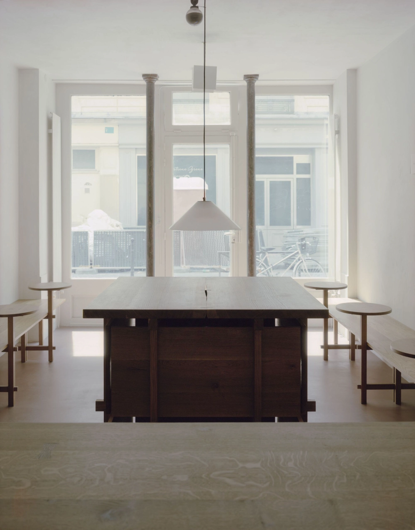 KURA-GE Coffee Shop blends Japanese craftsmanship with Parisian minimalism to create a quietly refined space