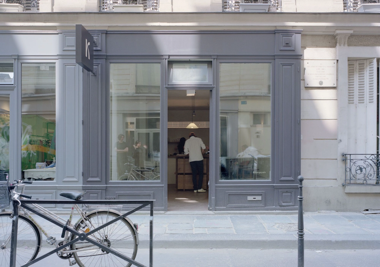 KURA-GE Coffee Shop blends Japanese craftsmanship with Parisian minimalism to create a quietly refined space