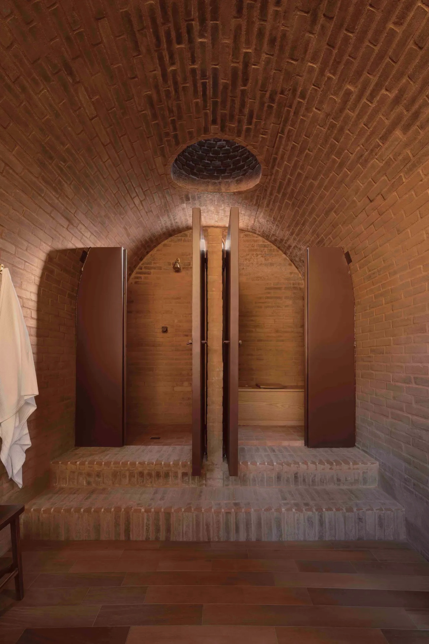 Casa de Barro by Goma Architects nestles into the rolling hills of Amealco, a vaulted brick retreat at Rancho El Ameyal