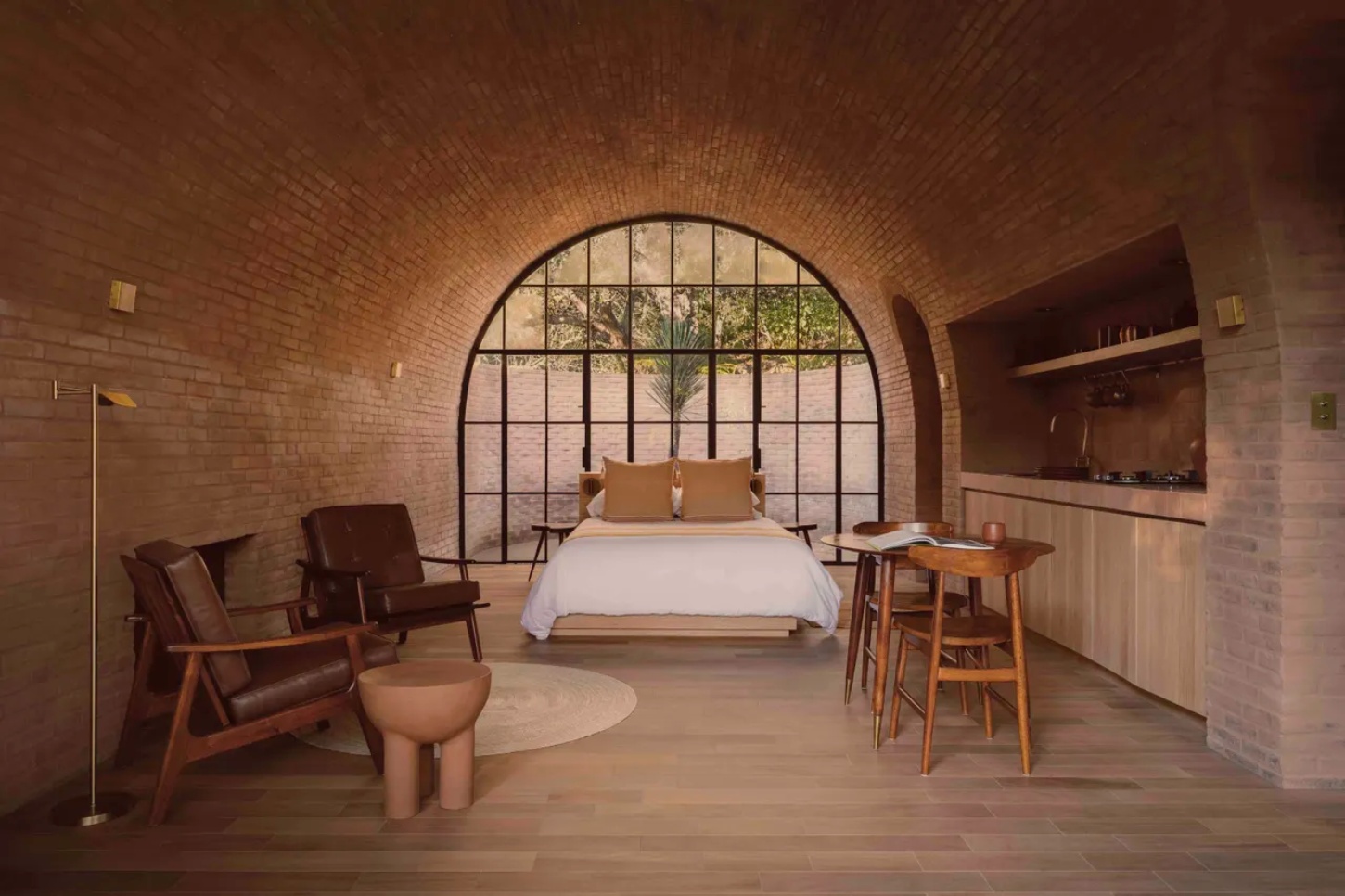 Casa de Barro by Goma Architects nestles into the rolling hills of Amealco, a vaulted brick retreat at Rancho El Ameyal