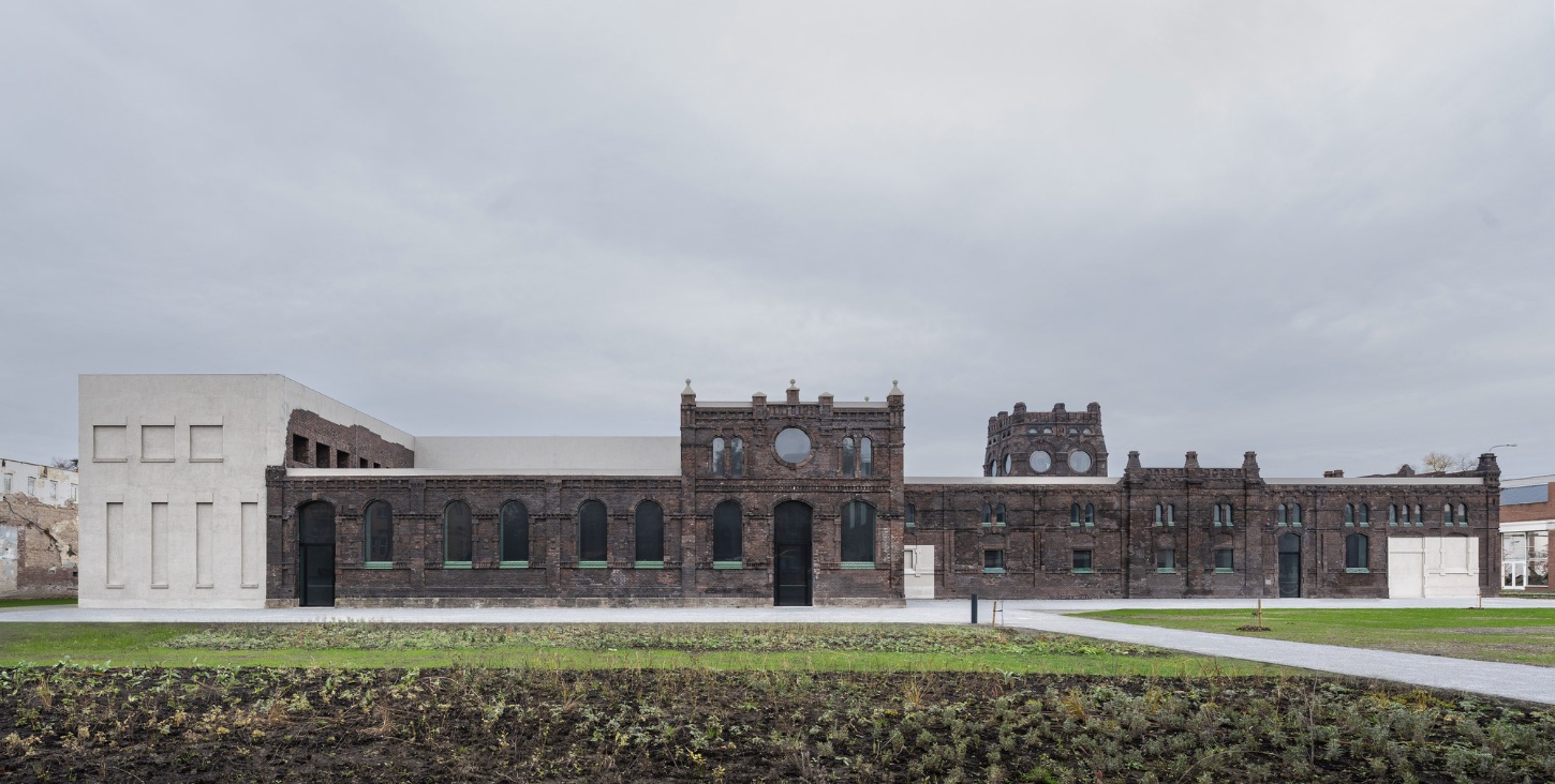 PLATO Contemporary Art Gallery by KWK PROMES — A brick industrial structure undergoes controlled transformation at PLATO Contemporary Art Gallery.