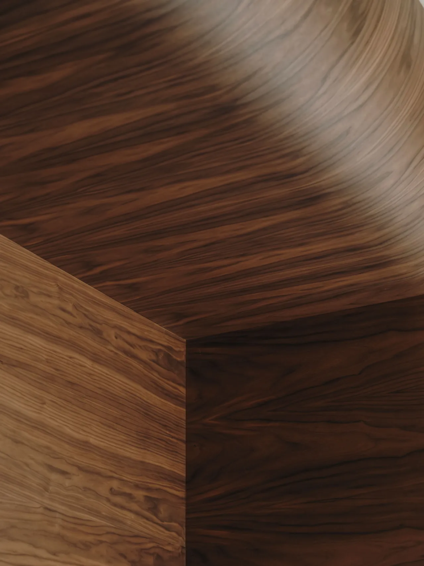 Jaç Hi-fi Cafe by Isern Serra — Close-up detail of Jaç Hi-fi Cafe's signature walnut surfaces, where the continuous grain pattern flows from horizontal ceiling plane to vertical edge of...