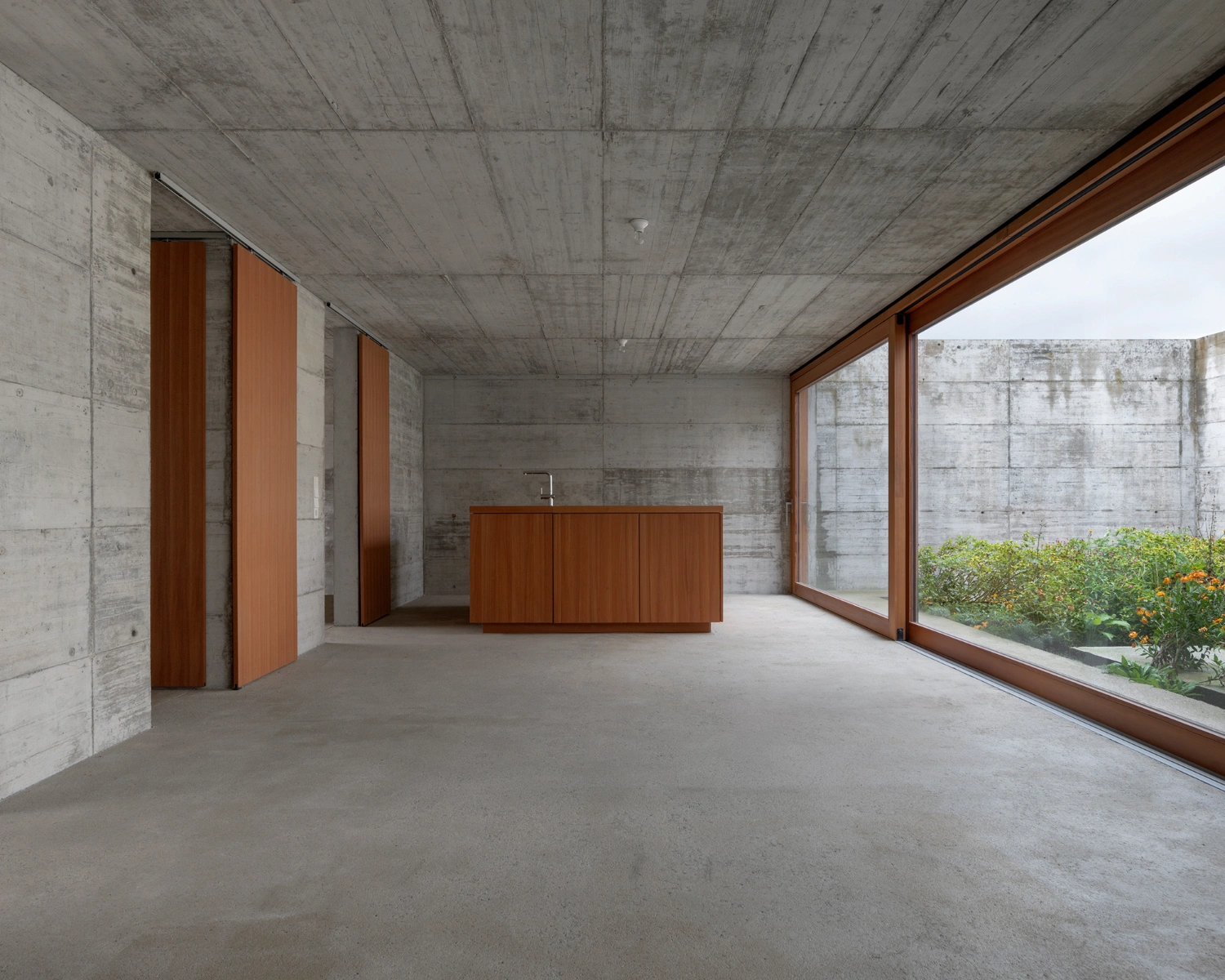 House with two courtyards by BÜRO MÜHLBAUER, concrete architecture, minimalist villa, german architecure, wood