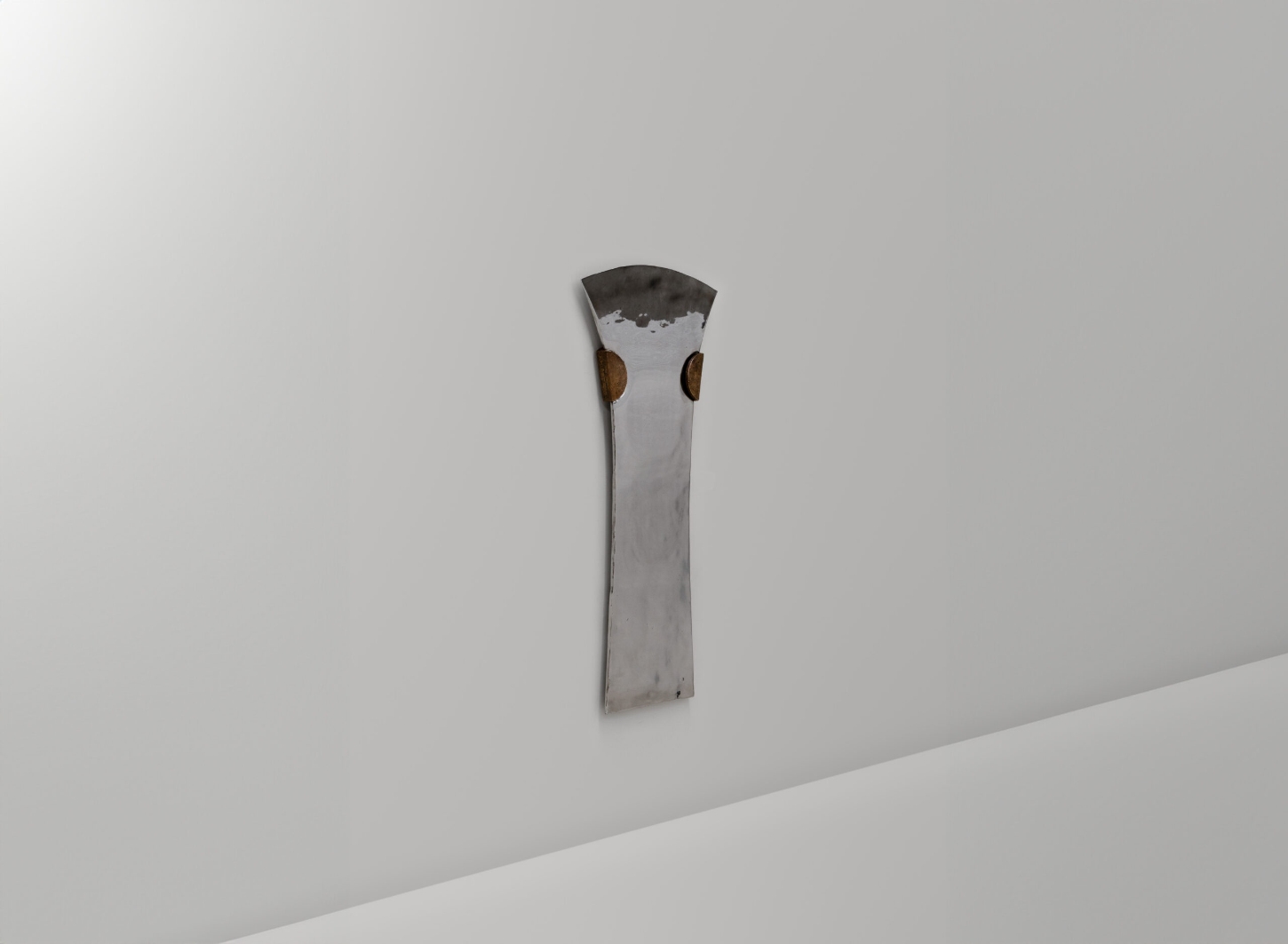 EXHUMA by EWE Studio merges volcanic stone with sand-cast aluminum, echoing Purépecha metalwork