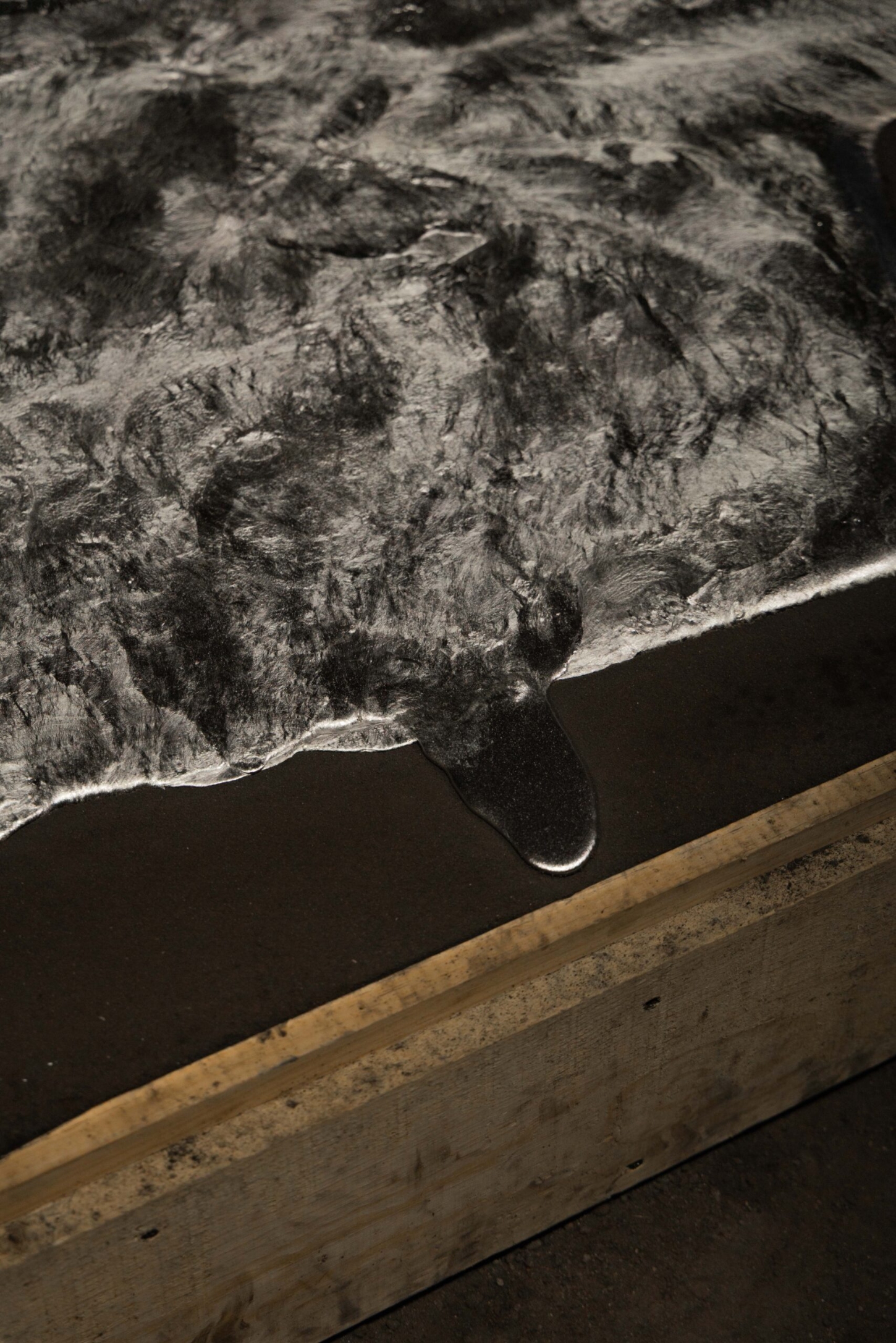 EXHUMA by EWE Studio merges volcanic stone with sand-cast aluminum, echoing Purépecha metalwork