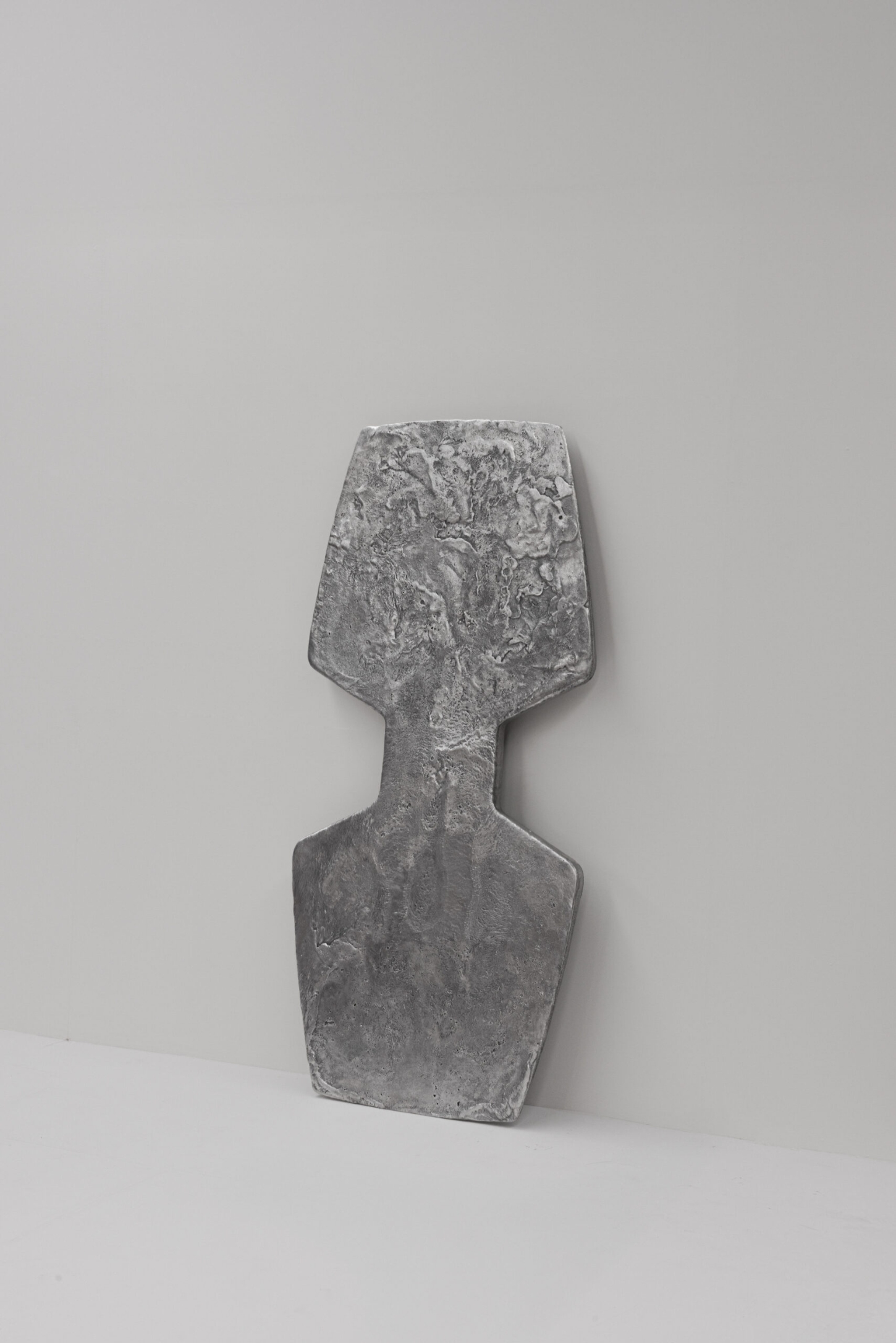 EXHUMA by EWE Studio merges volcanic stone with sand-cast aluminum, echoing Purépecha metalwork