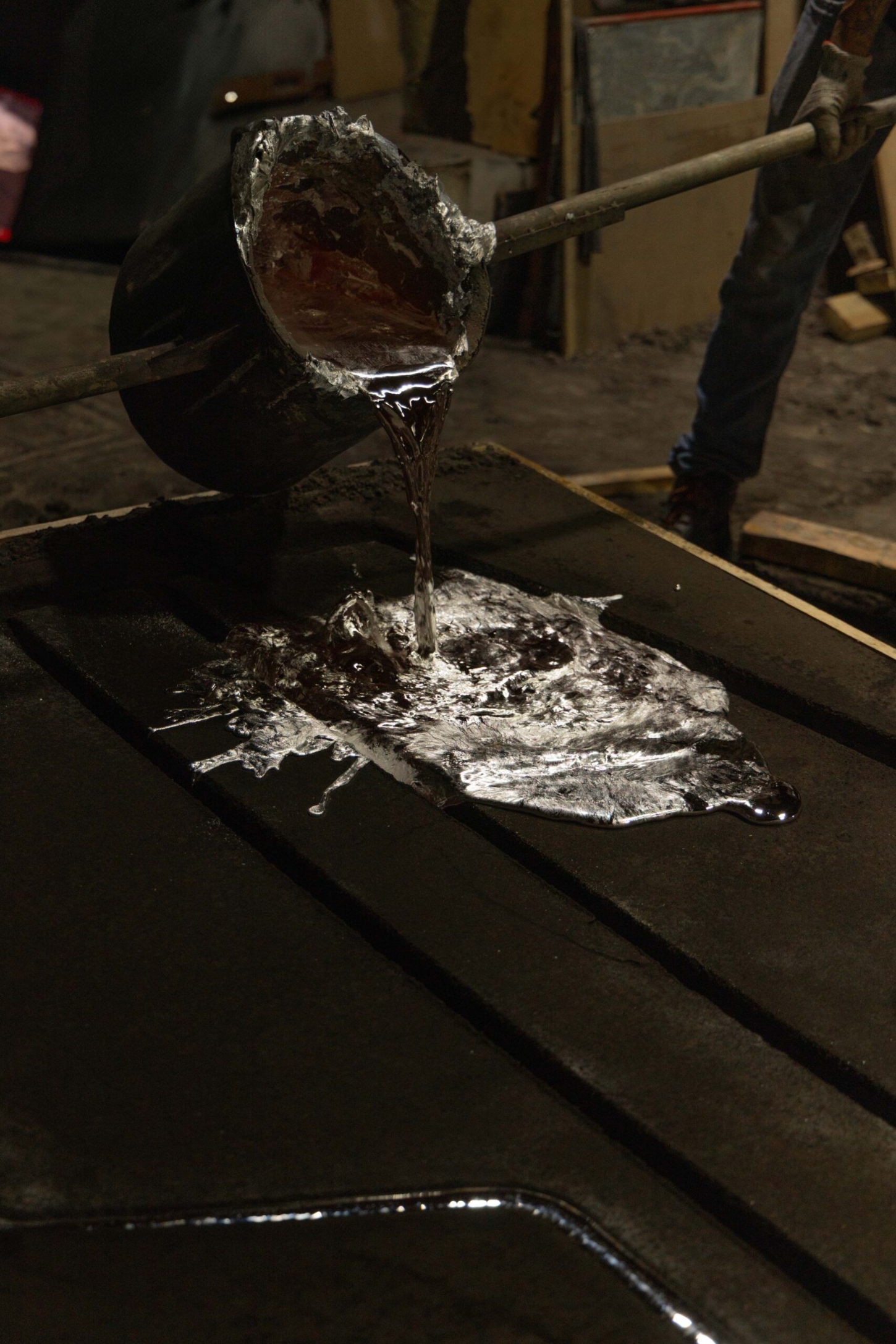 EXHUMA by EWE Studio merges volcanic stone with sand-cast aluminum, echoing Purépecha metalwork