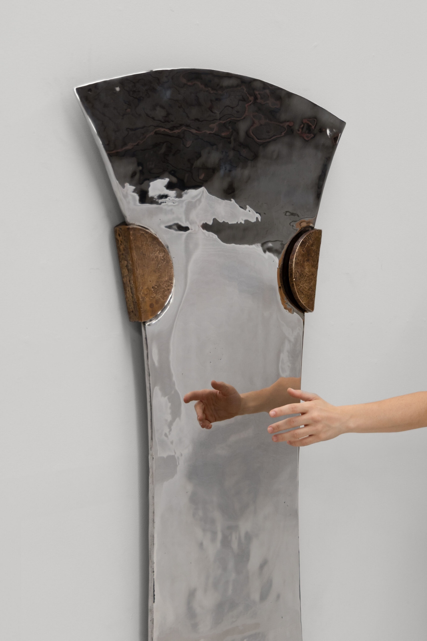 EXHUMA by EWE Studio merges volcanic stone with sand-cast aluminum, echoing Purépecha metalwork