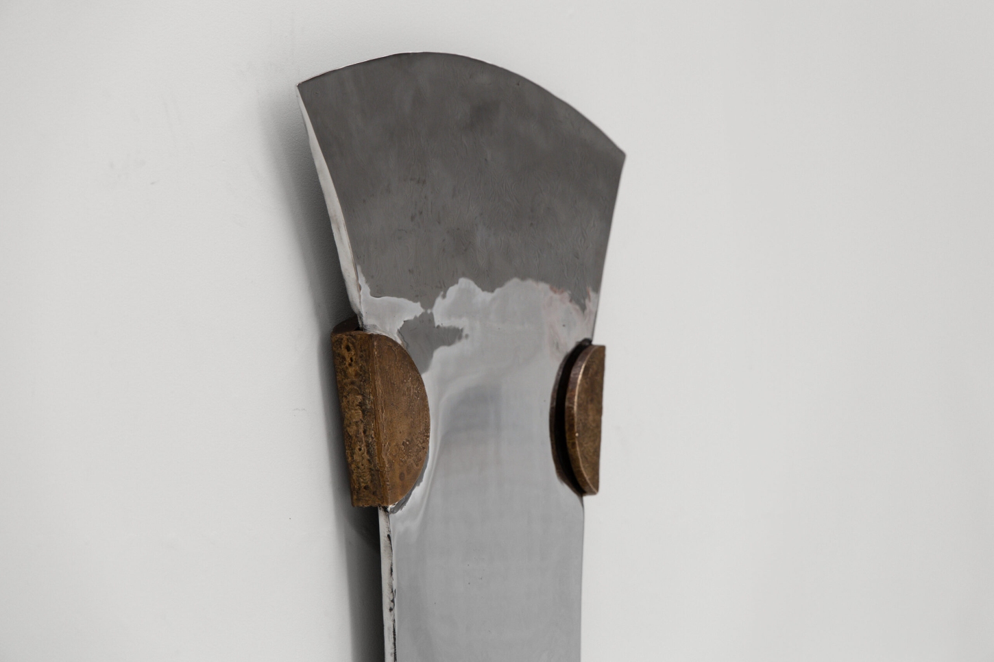 EXHUMA by EWE Studio merges volcanic stone with sand-cast aluminum, echoing Purépecha metalwork