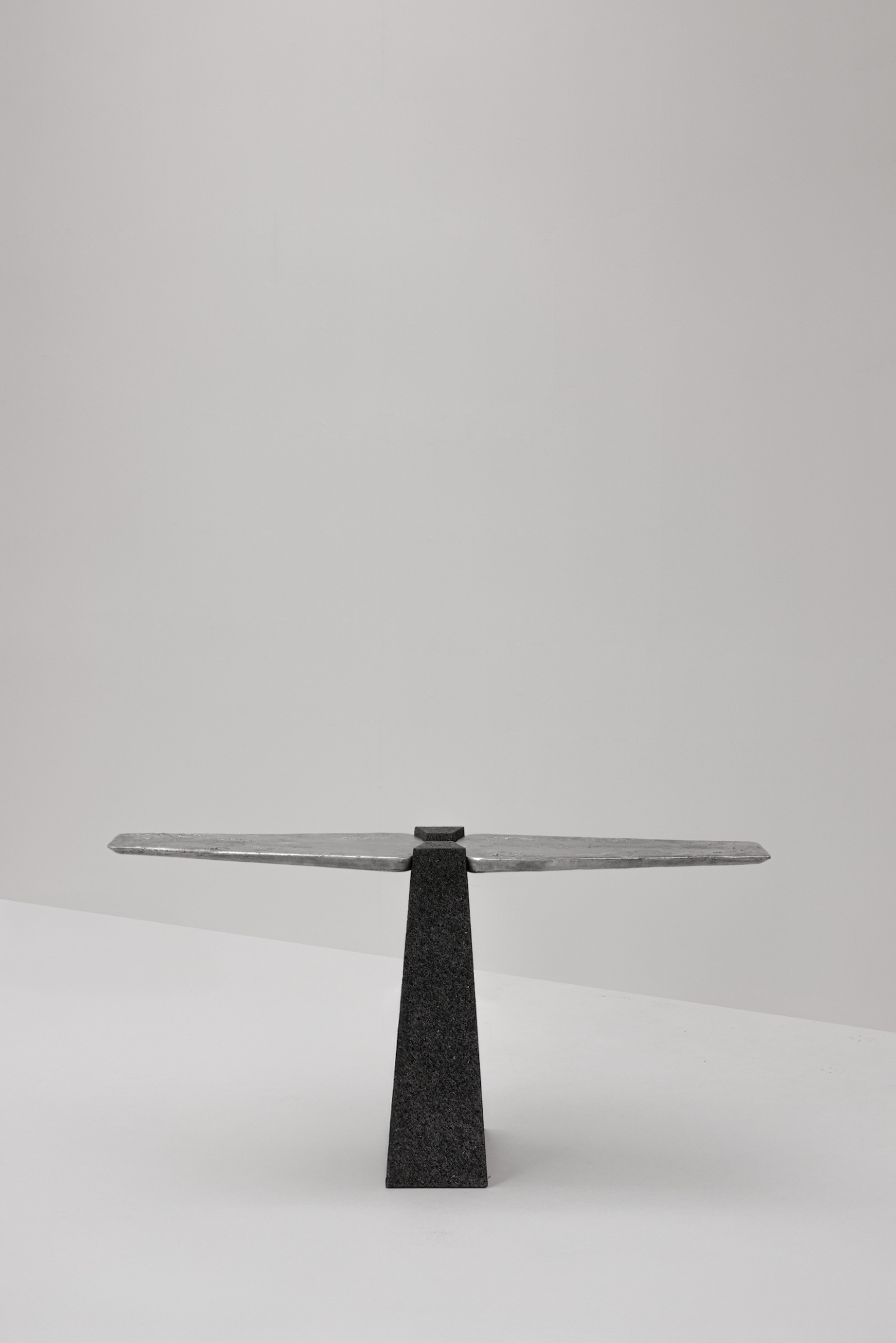 EXHUMA by EWE Studio merges volcanic stone with sand-cast aluminum, echoing Purépecha metalwork