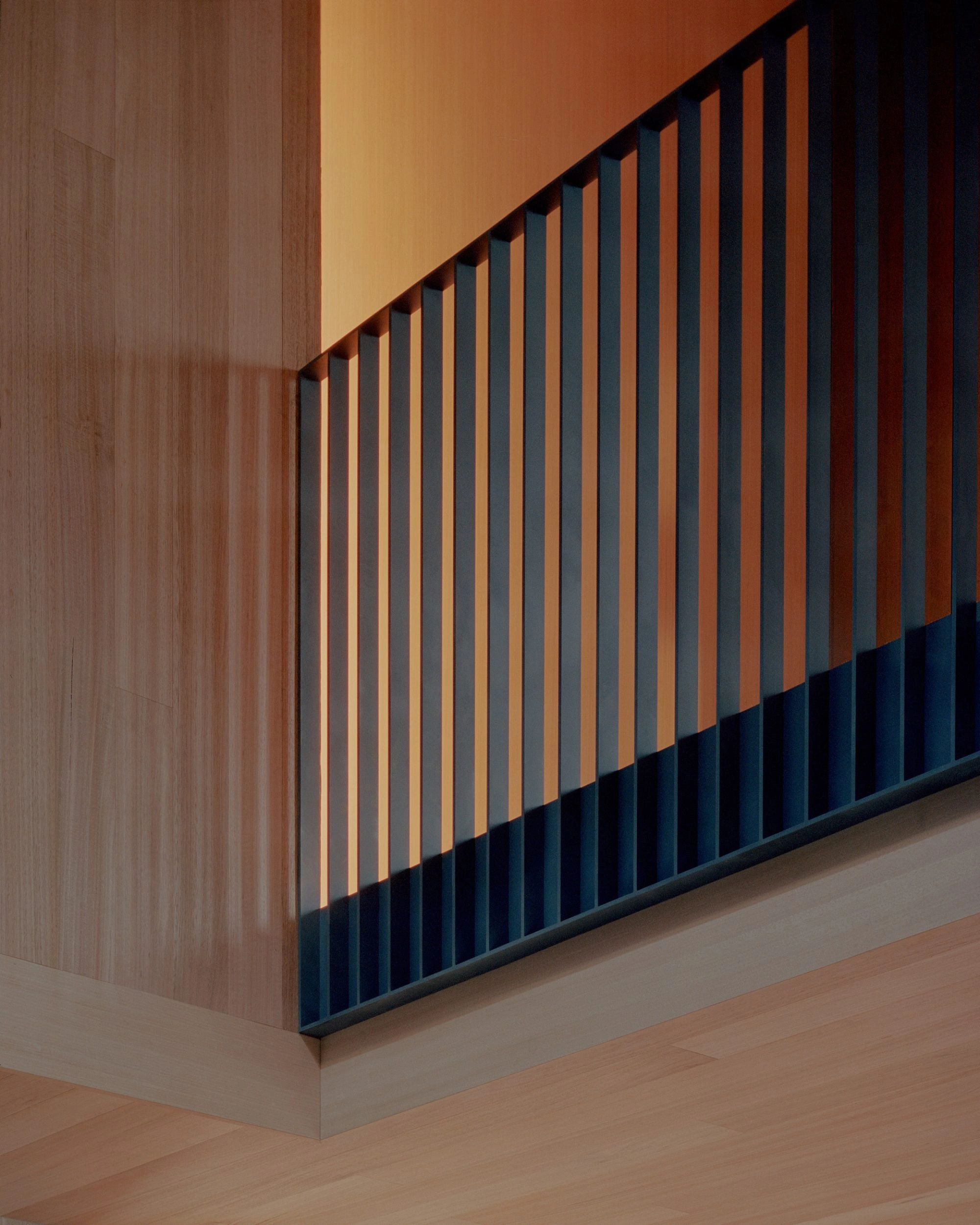 Echo House by Parabolica — A corner detail of Echo House's sculptural bookshelf, captured in low-angle view.