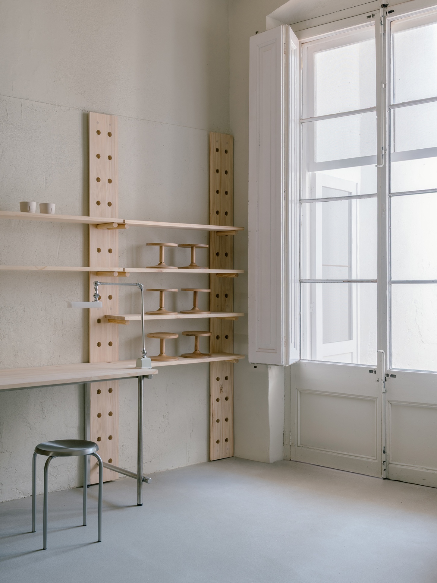 Catalina Studio by Correa Studio is a modular, tactile minimalist space for ceramic in Barcelona where form supports function and flow