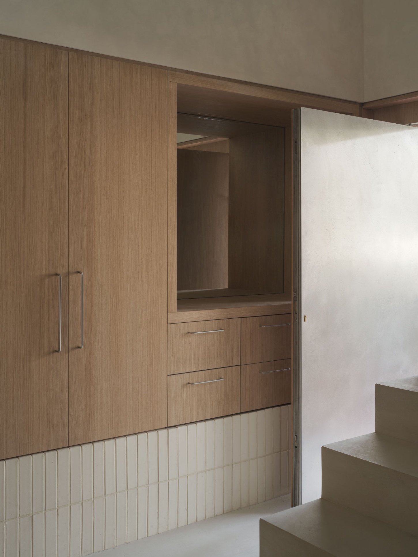 Casa SO by Studio DIIR — A timber-lined passage frames an opening into a recessed bedroom alcove.