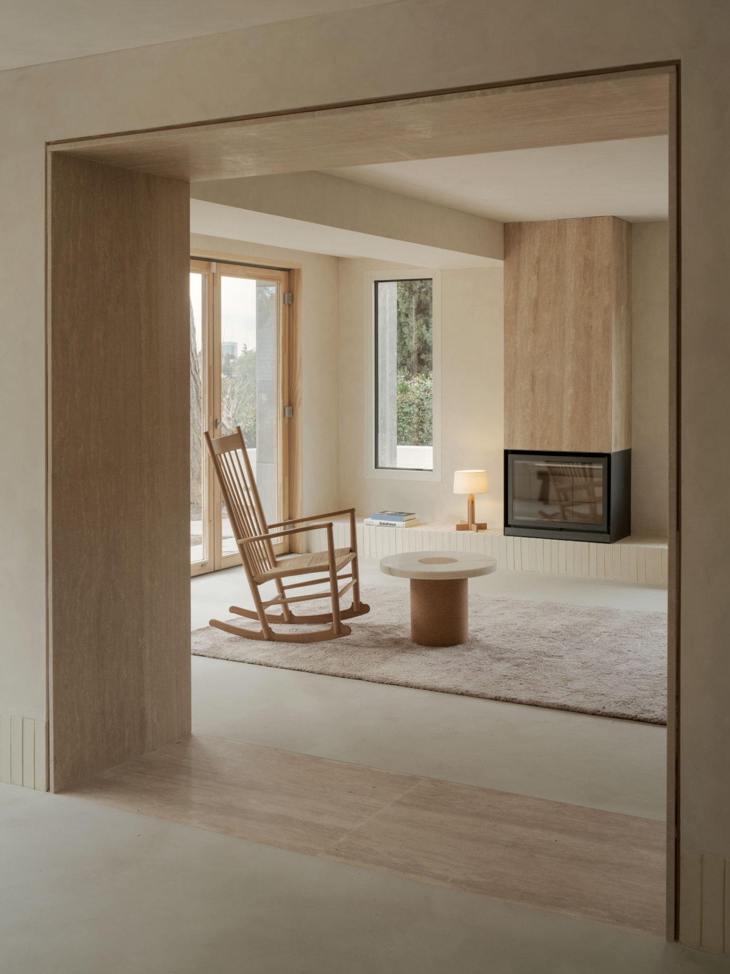 Casa SO by Studio DIIR — A timber-framed threshold creates a recessed layered opening into a living space, the frame's warm oak tone establishing a tactile boundary between...
