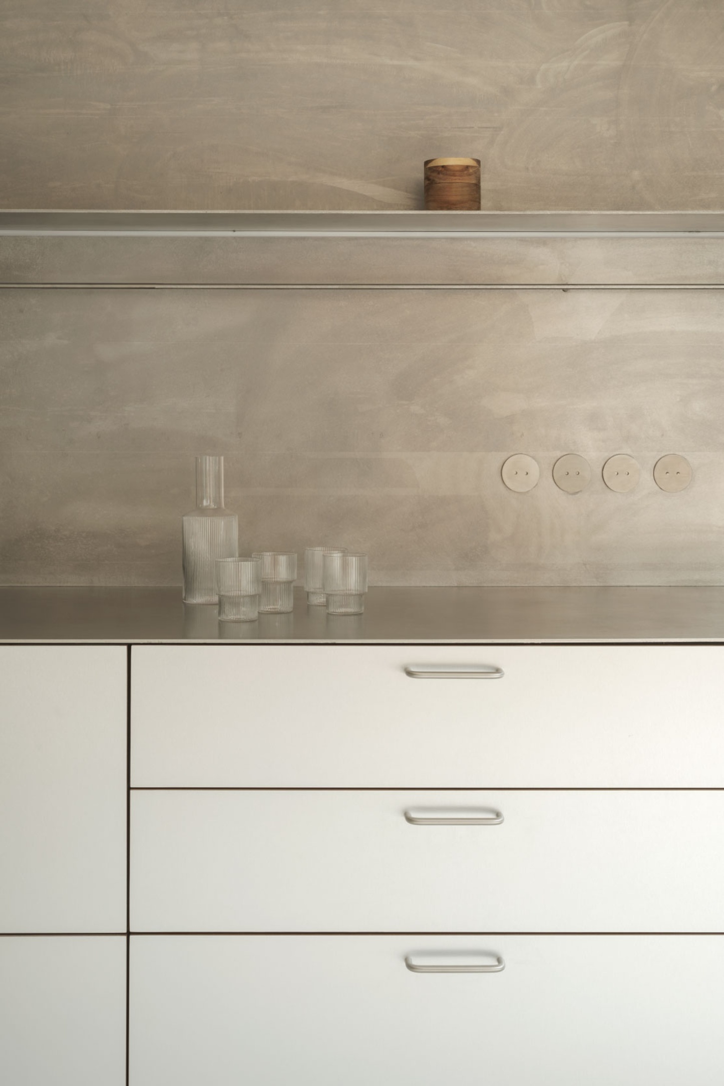 Casa SO by Studio DIIR — A minimalist kitchen workspace defined by horizontal layering and material contrast.