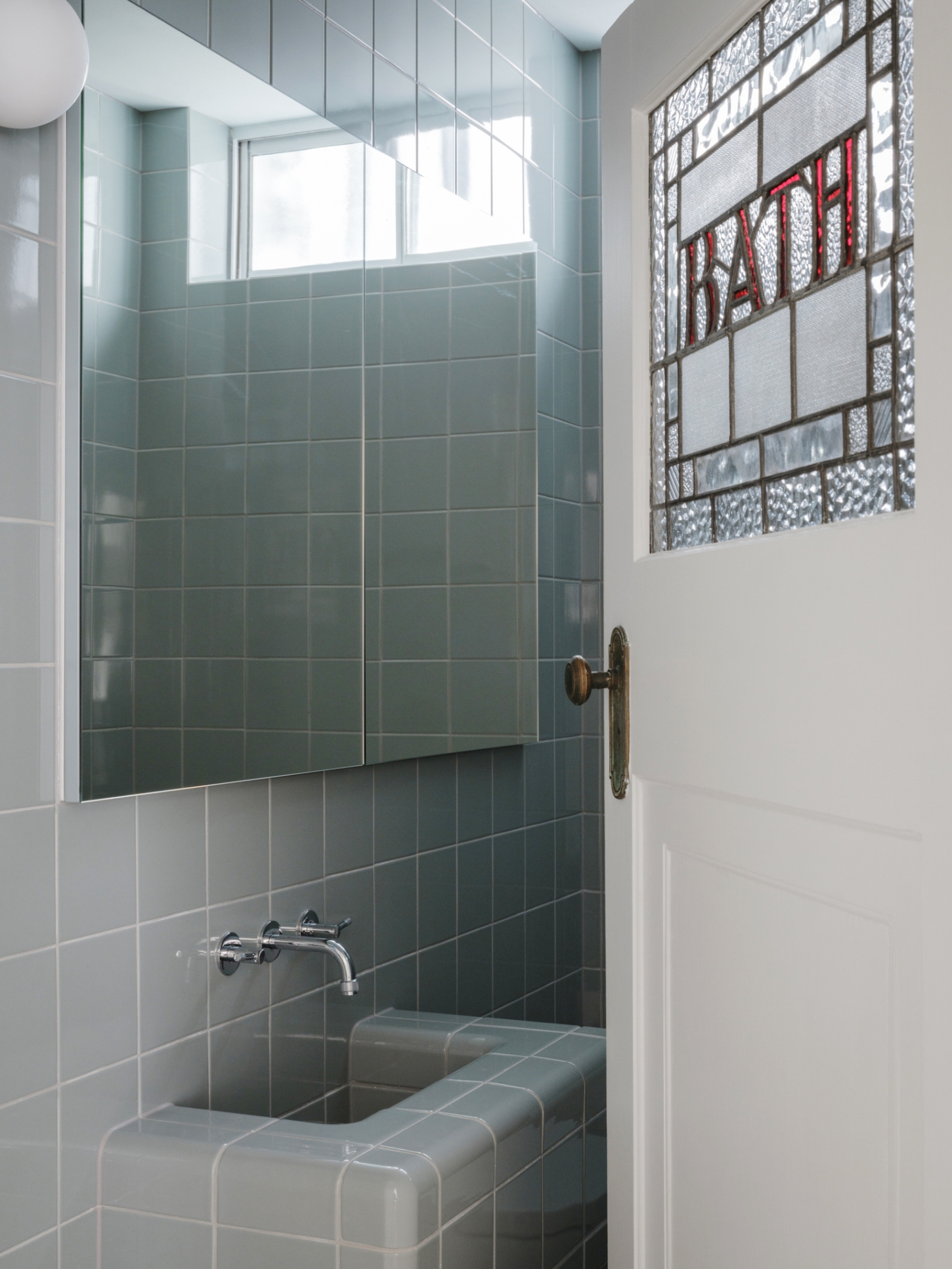 Onslow Gardens Apartment by Youssofzay Hart — The shower enclosure features eucalypt-hued D-Tiles in a modular grid pattern, wrapping the bathing space in soft geometry.