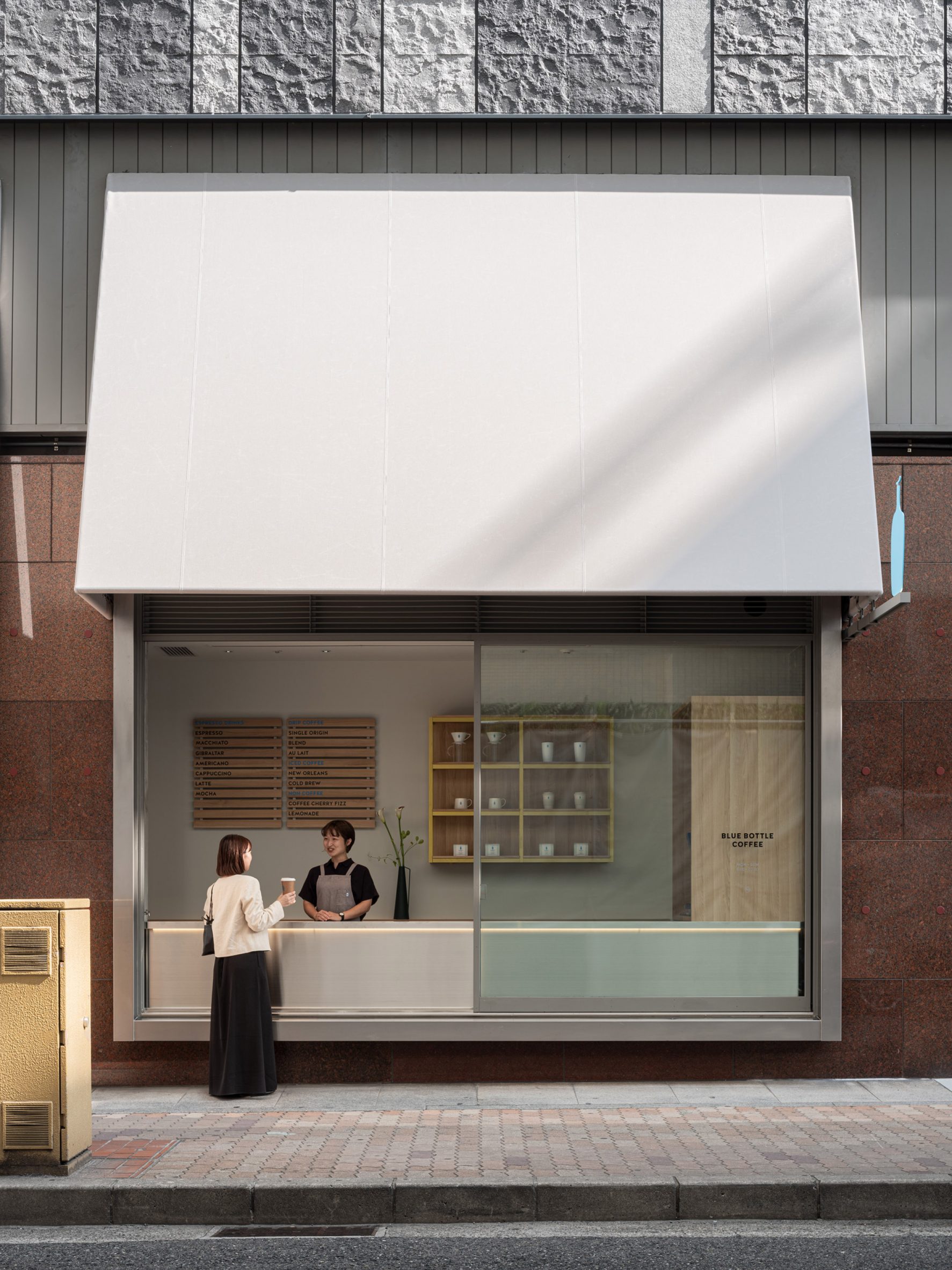Blue Bottle Coffee Kobe Hankyu Cafe by Keiji Ashizawa — Blue Bottle Coffee's Kobe storefront presents a pedagogical clarity through material contrast.