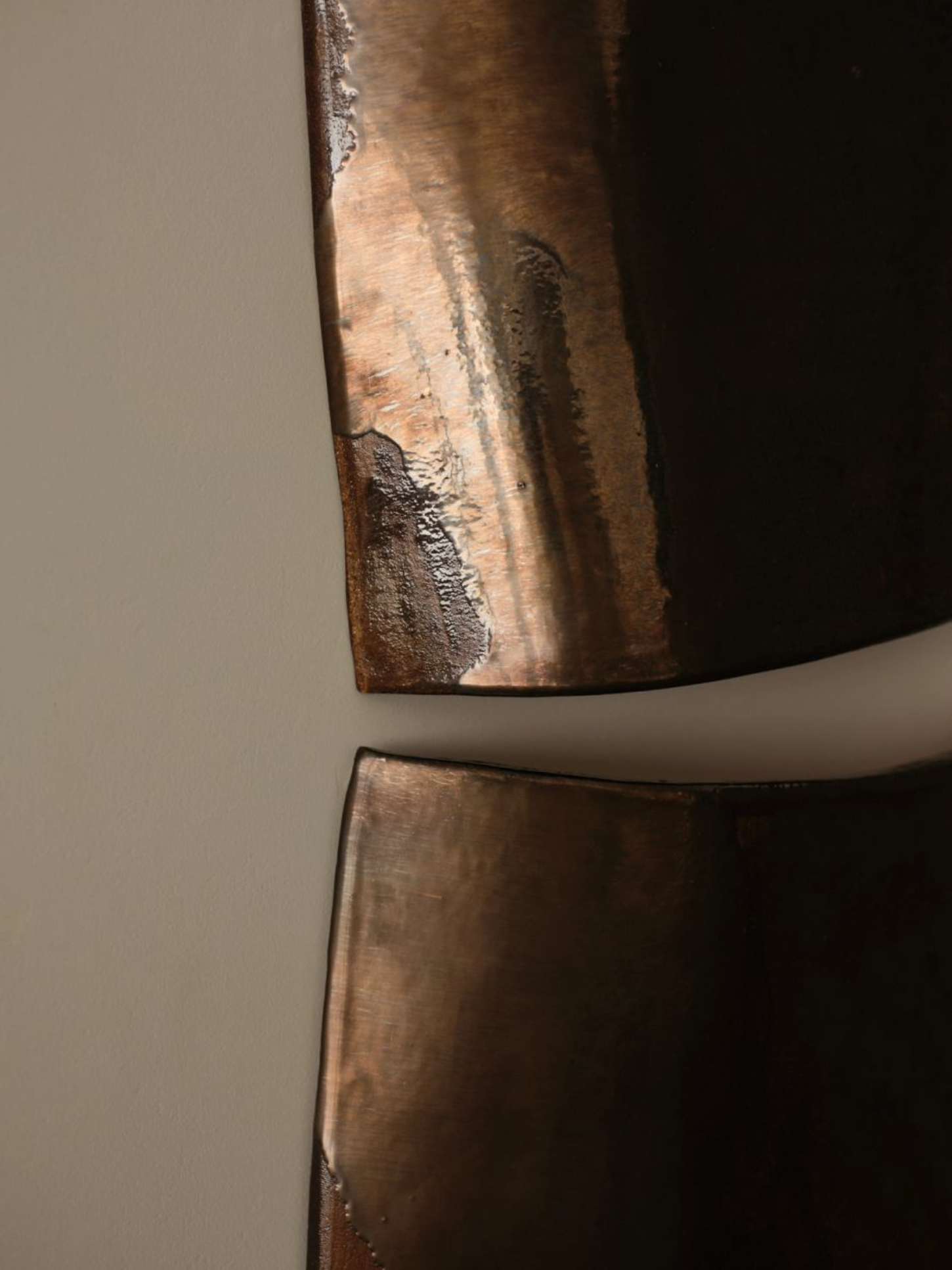 ‘Untitled’ by JAMESPLUMB & Garcé Dimofski at Francis Gallery — Close-up detail of a weathered copper or bronze pipe joint, capturing the material's oxidized surface and patinated finish.