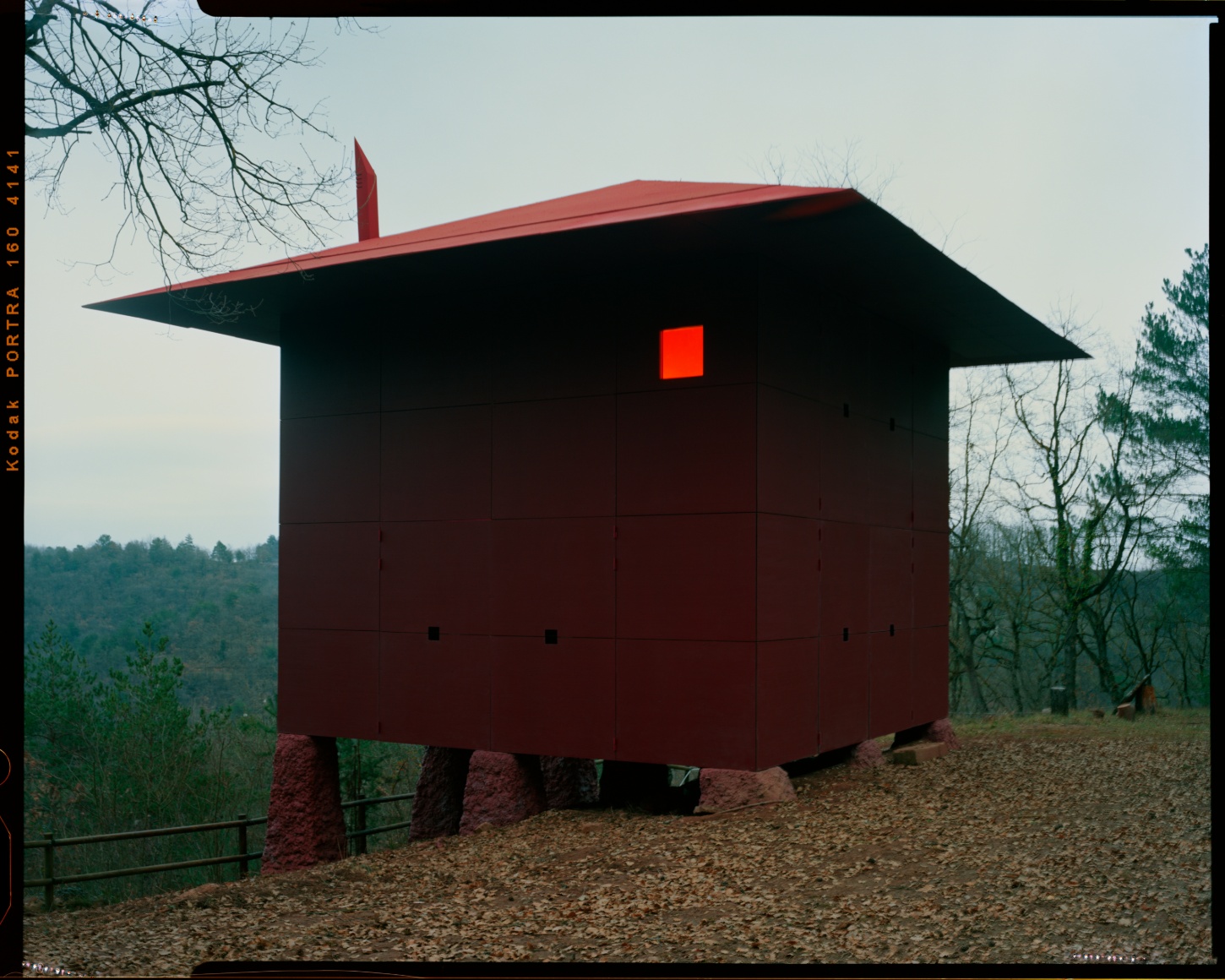 TEST perches prefab wooden house atop shotcrete pillars in barcelona woodlands spain