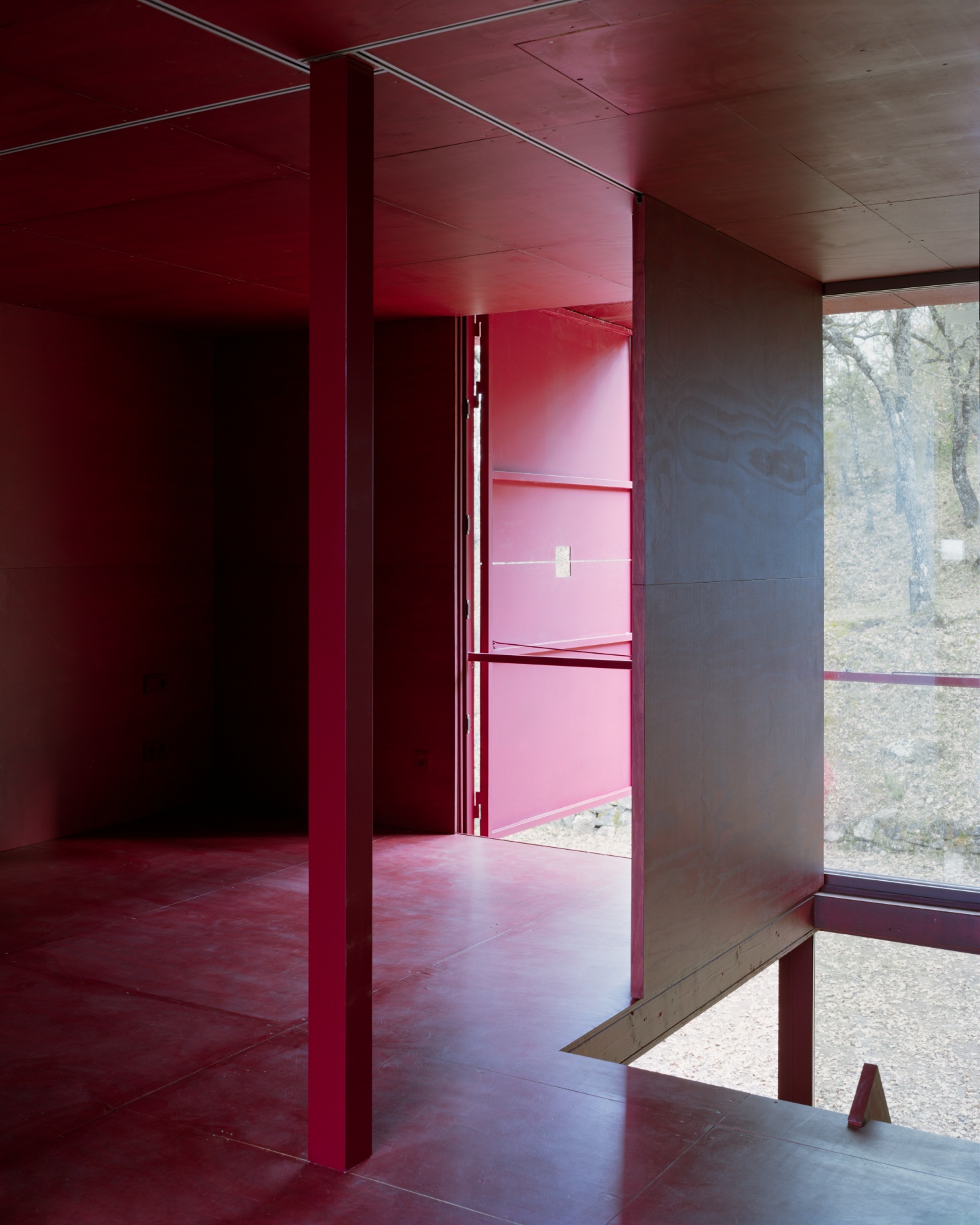 TEST perches prefab wooden house atop shotcrete pillars in barcelona woodlands spain