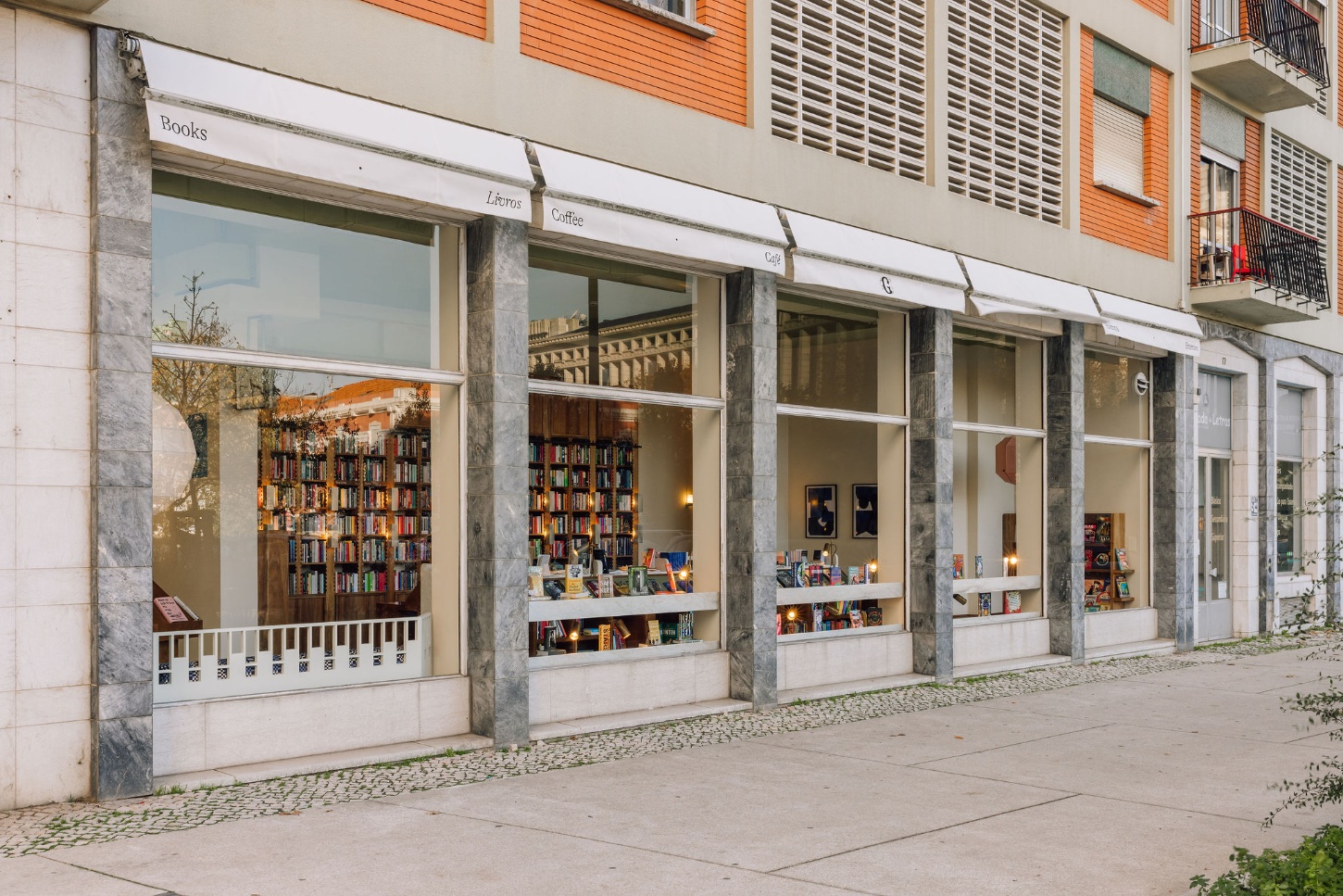 Good Company Books by Studio PIM — The street-facing elevation of Good Company Books presents a unified commercial frontage across multiple storefront bays.