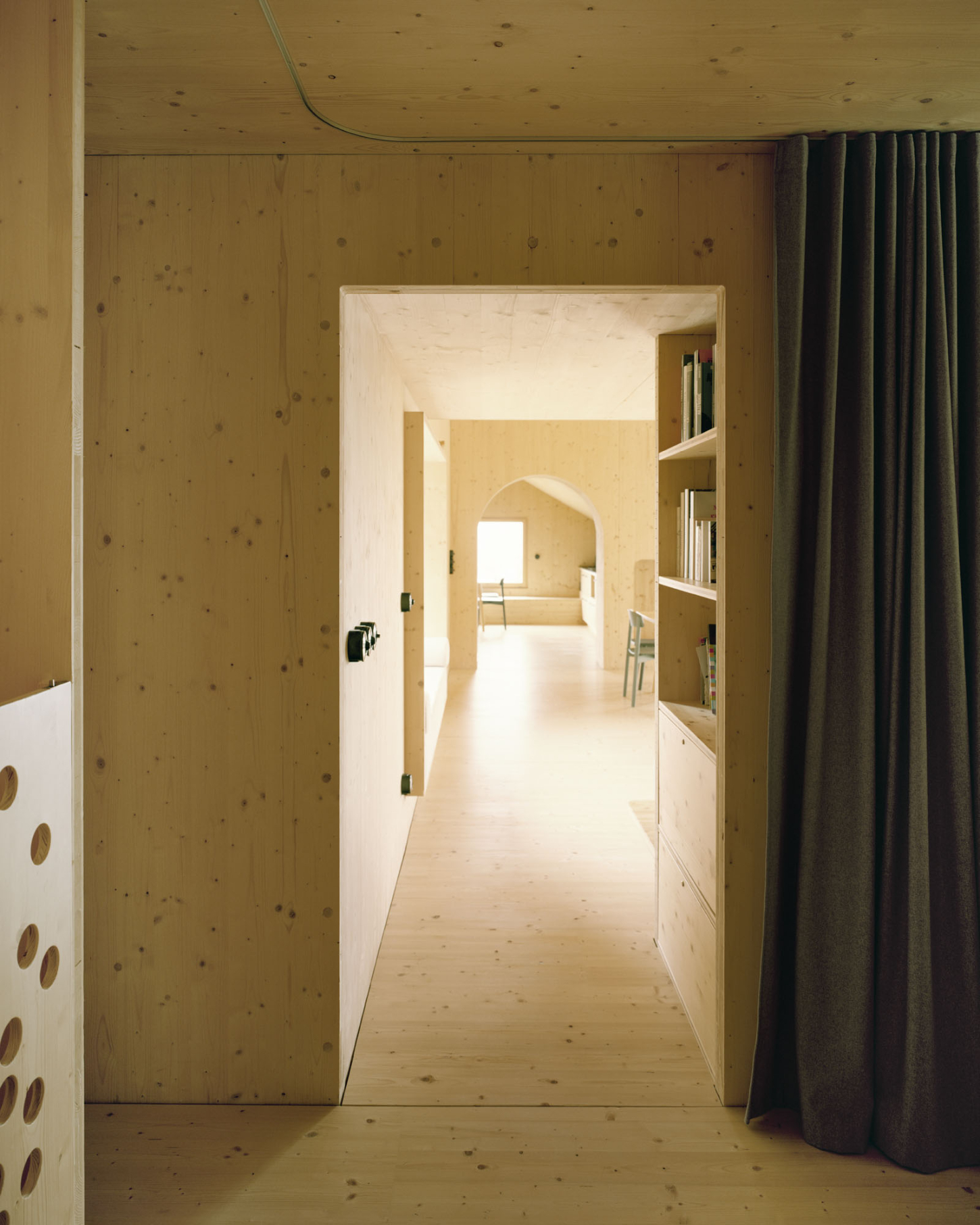 Maison Hiltiti captured by Rasmus Norlander by Atelier Ordinaire — A corridor perspective through Maison Hiltiti reveals the spatial logic of cross-laminated timber construction.