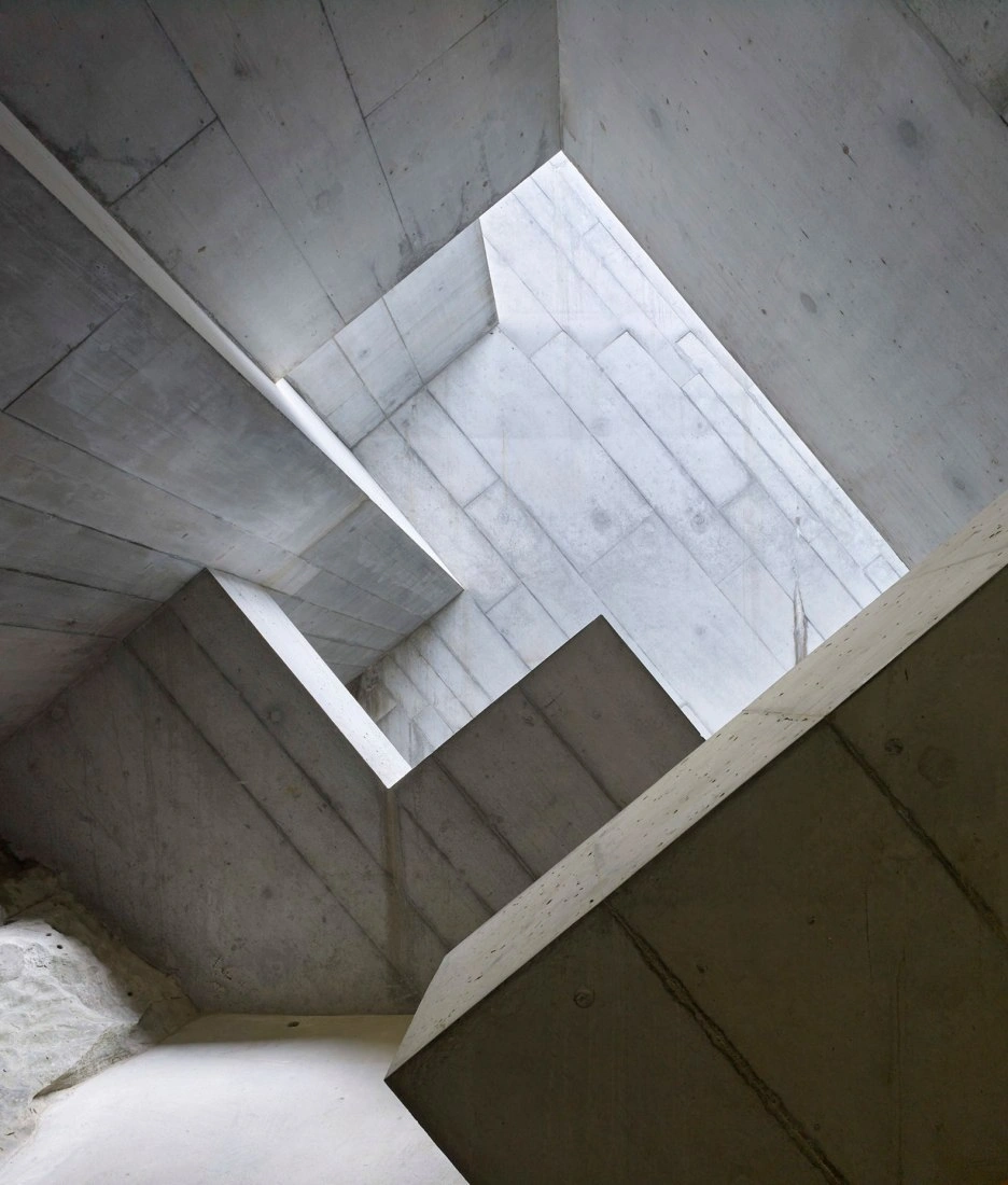 Glacier Garden Museum (Gletschergarten) Extension by Miller & Maranta — An upward view into a rectangular skylight opening that penetrates the raw concrete ceiling of the museum extension.