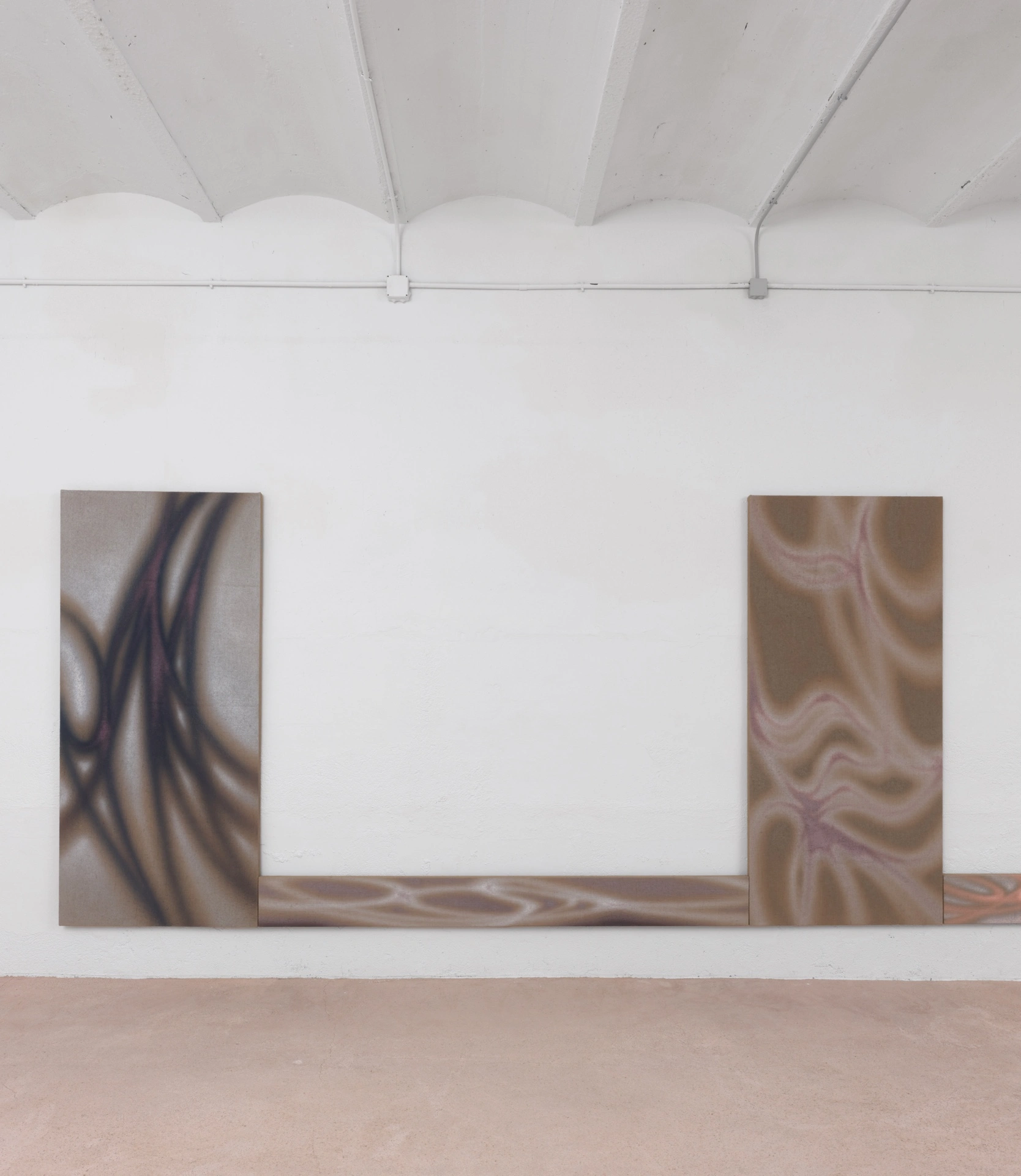 One Panoramic View After Another Will Unfold by Lucas Dupuy at Belmonte — Three large-scale canvases with swirling, fluid patterns in muted earth tones and taupe hues are mounted above a continuous timber base in a gallery interior.