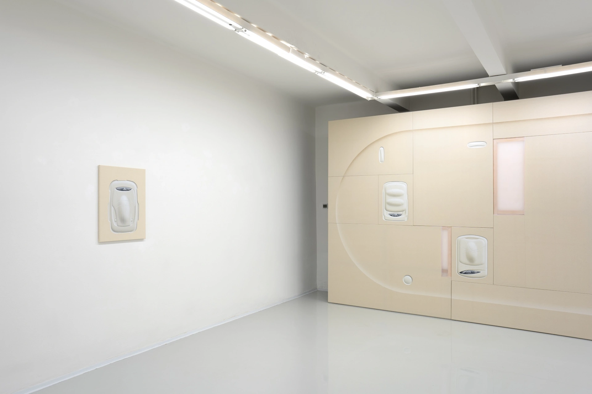 [face_not_recognized] by Milan Vagač — A gallery installation featuring a cream-colored modular wall system with integrated hand-sanitizer dispensers.
