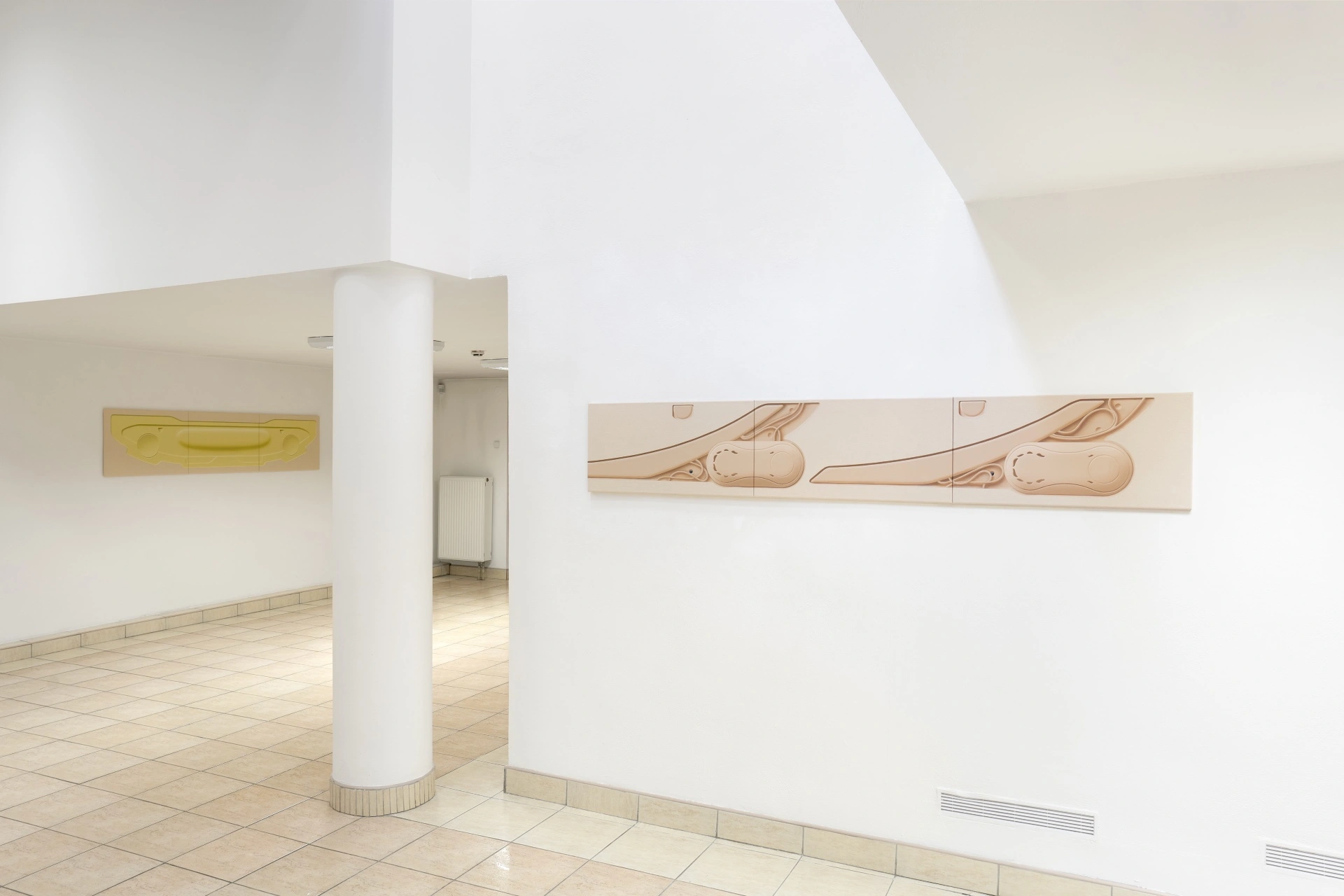 [face_not_recognized] by Milan Vagač — Gallery interior featuring three wall-mounted wooden panels with abstracted vehicle silhouettes rendered in pale mauve and cream tones.