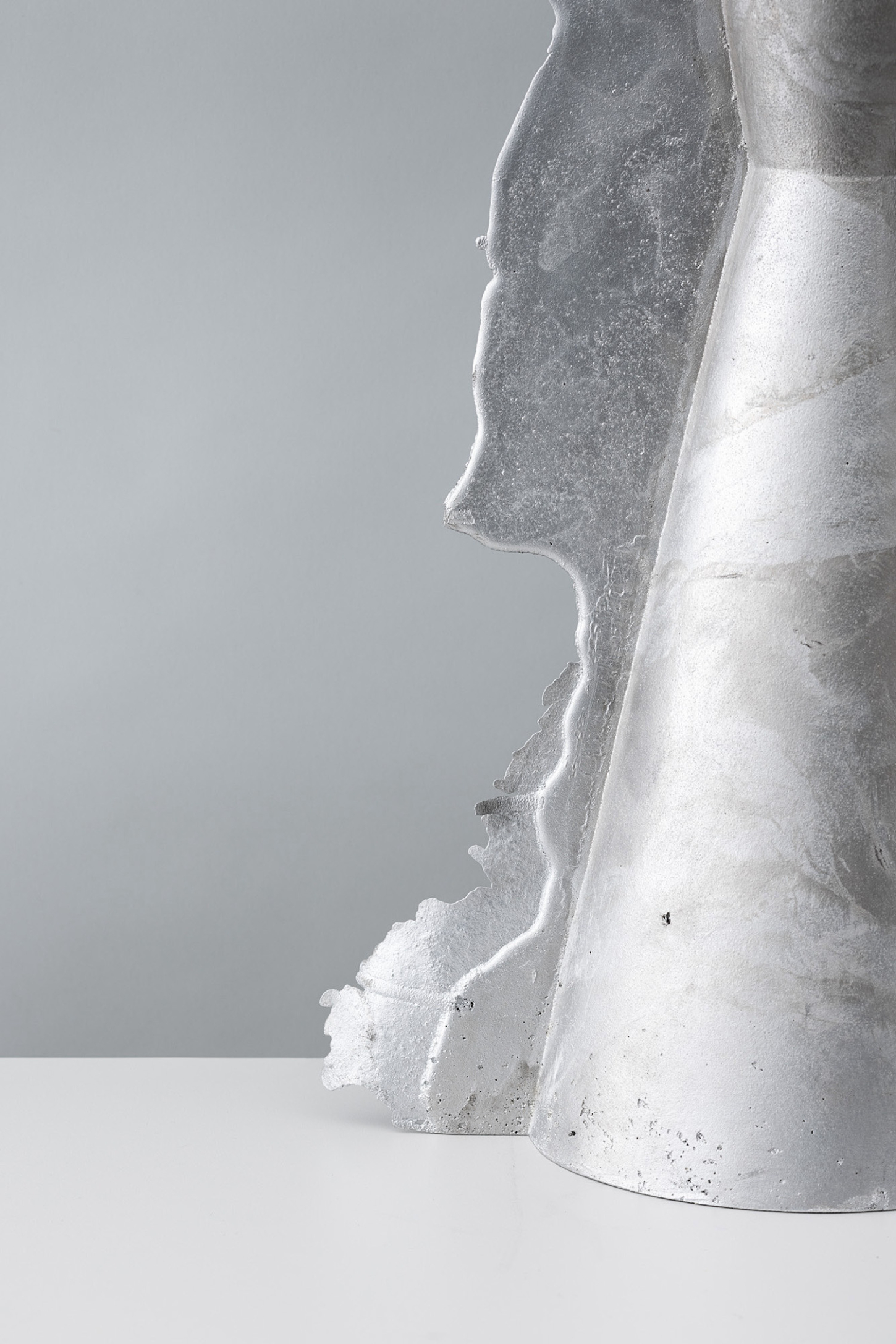 Vessels of Imperfection by Anna Zimmermann — A cast aluminum vessel photographed at close range reveals the deliberate exposure of its production seams.