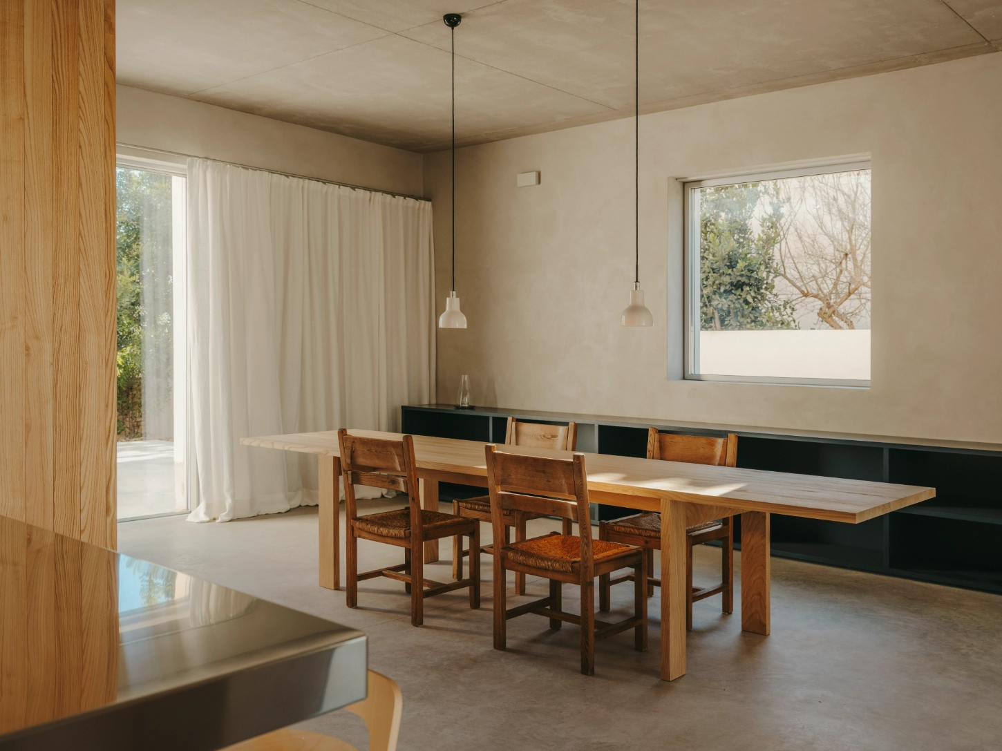 Casa TD by Skye Maunsell, Jordi Veciana and Juan Gurrea Rumeu — The dining room demonstrates spatial organization through materiality and framing.
