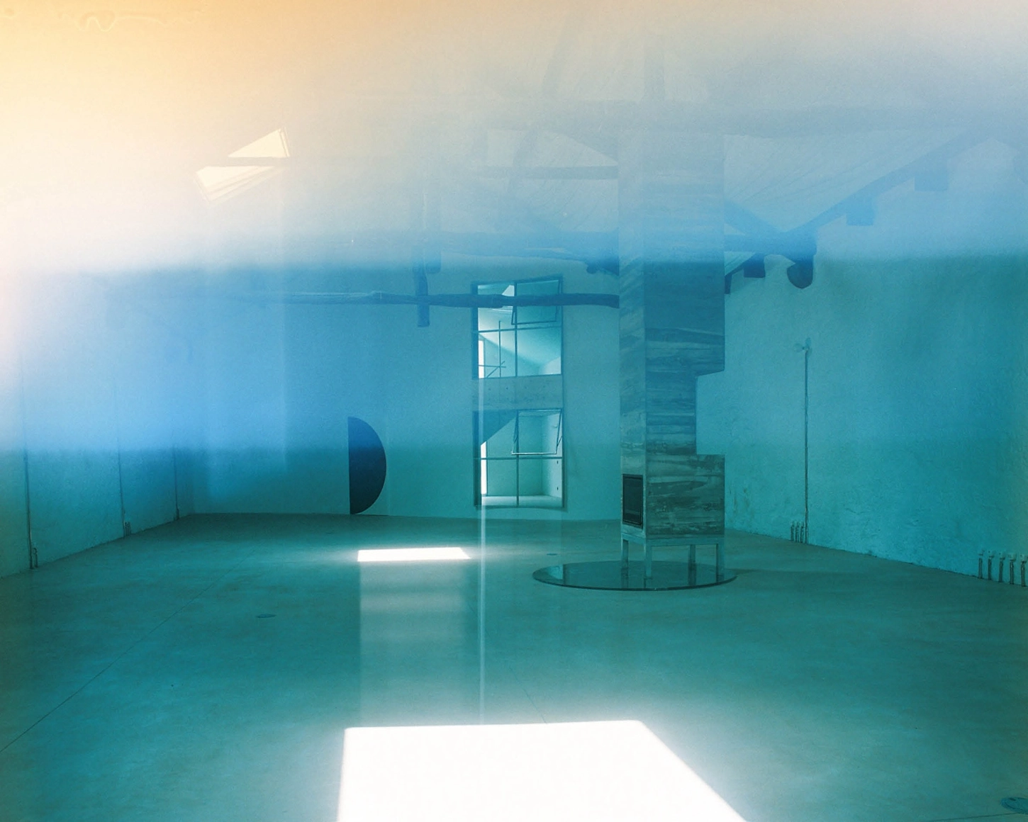 'House with many faces' by Fala Atelier — A spatially transformed interior bathed in cool turquoise light, where multiple overlapping planes create depth through layered transparency.