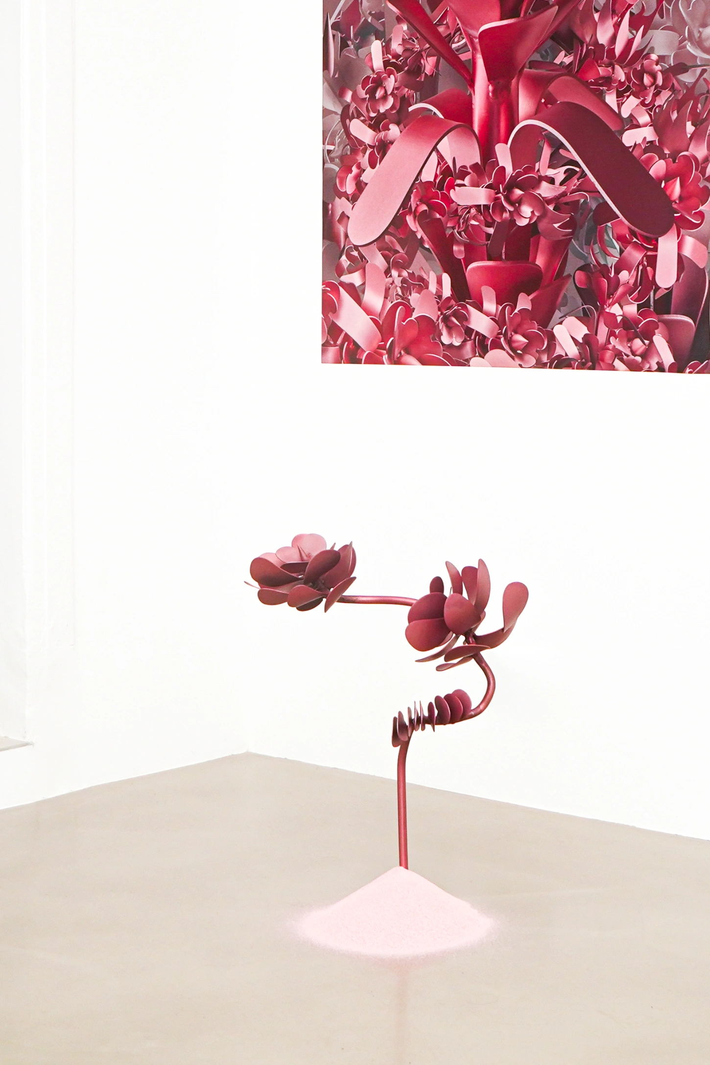 PINKDOM by Knit Pigment — A single sculptural stem extends vertically from a mounded pink base, crowned with two organic, curved flower-like forms rendered in deep crimson.