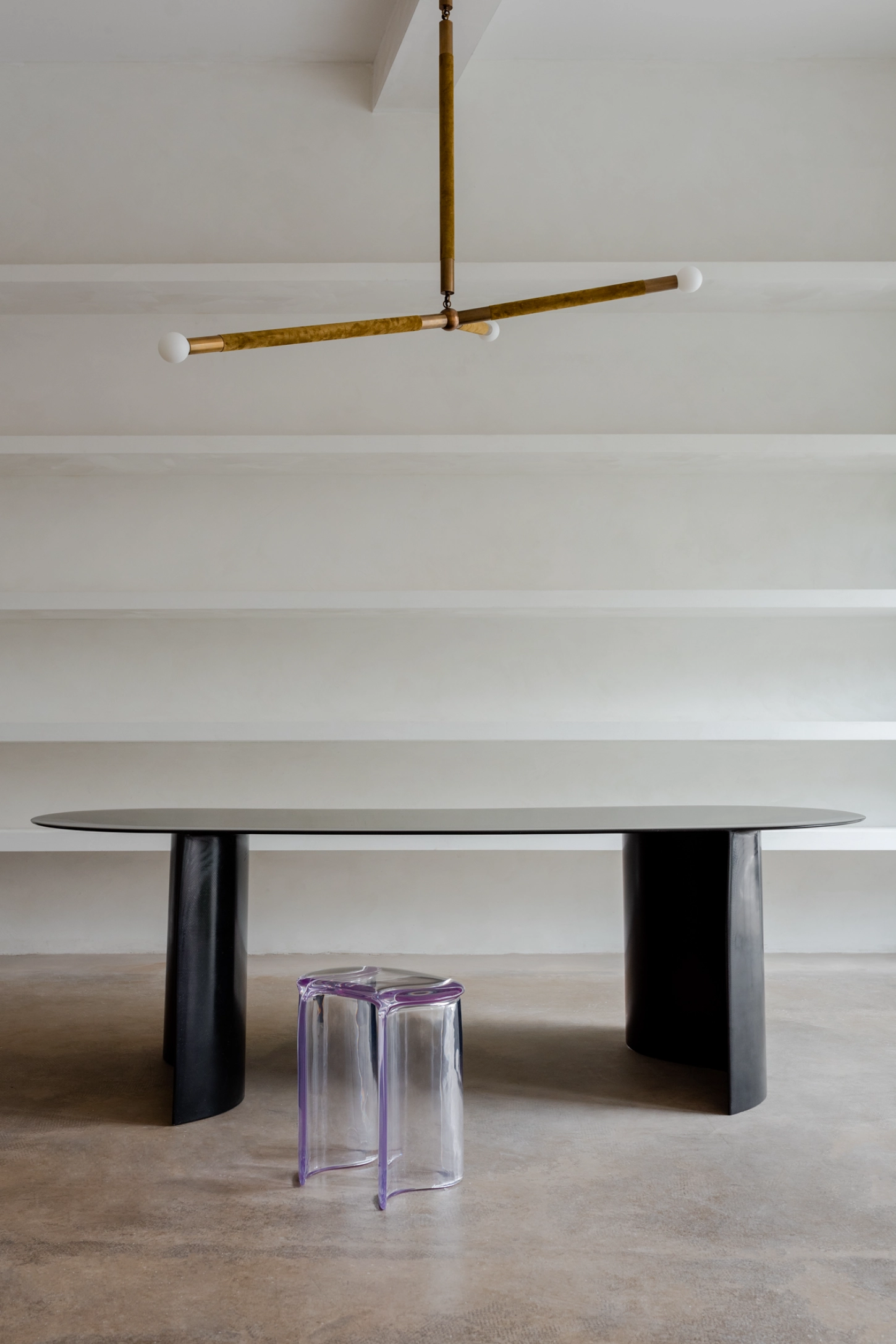 NEW WAVE by Lukas Cober — Lukas Cober's NEW WAVE collection positions a black oval dining table with paired curved pedestal bases as sculptural counterpoint to the room's...