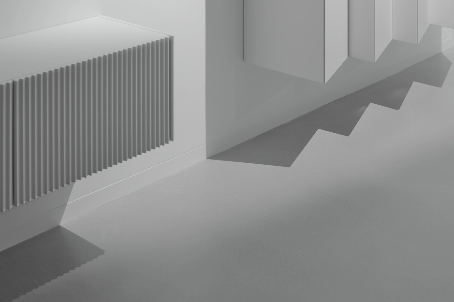 VVV by i.B Archstudio — A monolithic concrete staircase descends through a white interior, its stacked treads creating pronounced horizontal shadow lines across pale walls.