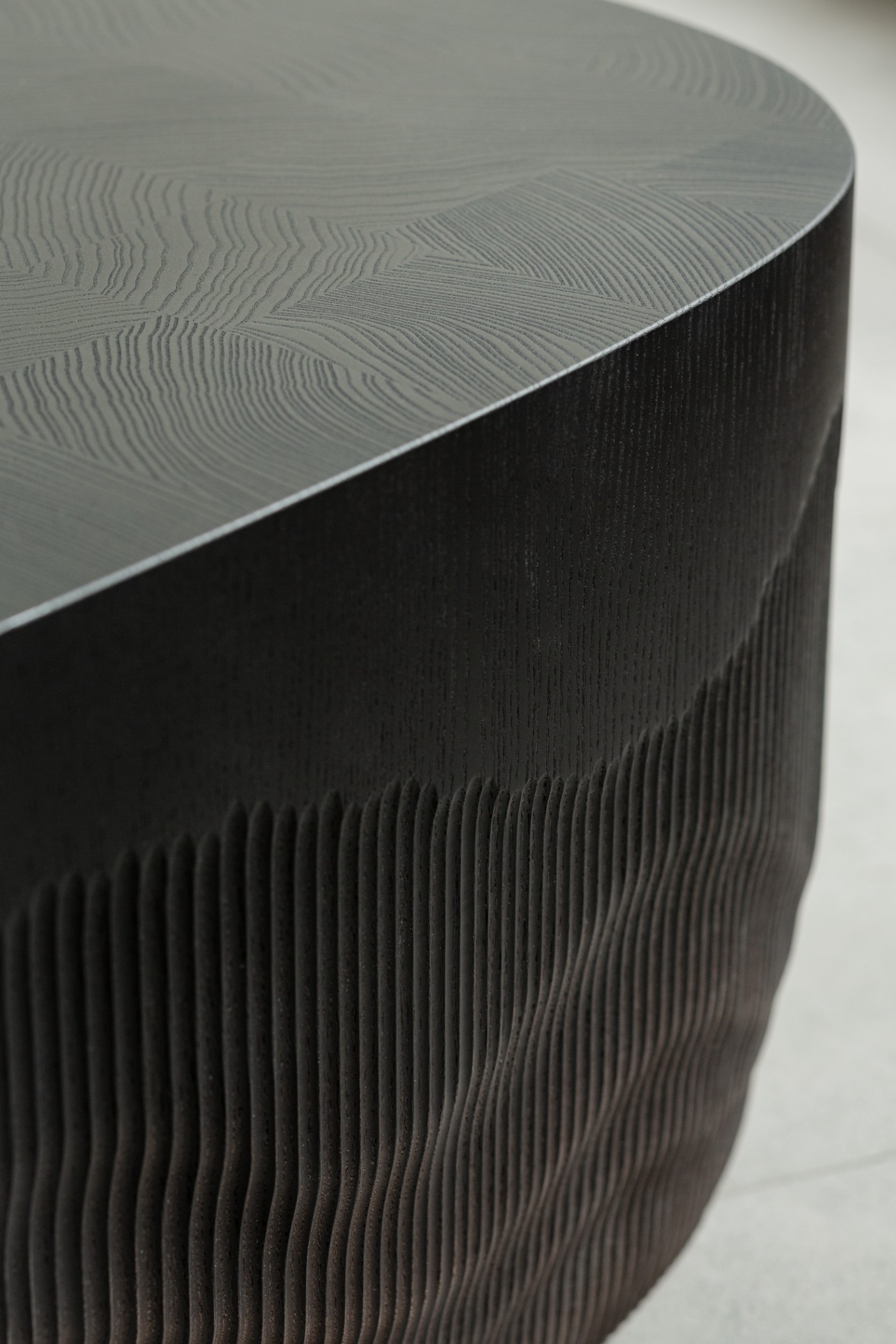 TRACES Exhibition by Antrei Hartikainen — Detail of wooden installation featuring vertical timber slats of graduated lengths suspended in cascading formation.