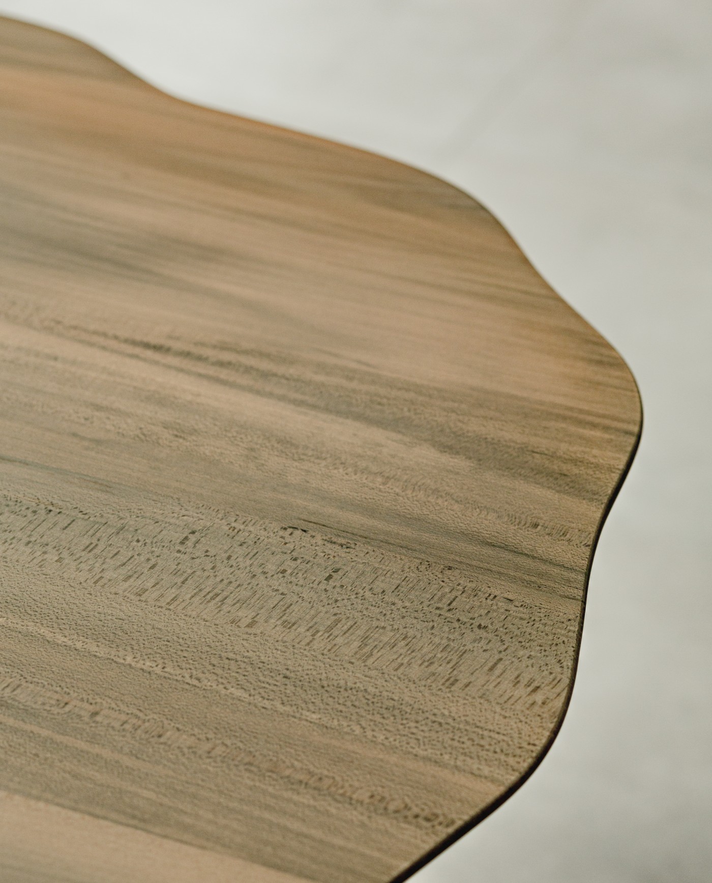 TRACES Exhibition by Antrei Hartikainen — Close-up detail of wooden slats with graduated lengths and irregular spacing, suspended to create a cascading fringe effect.
