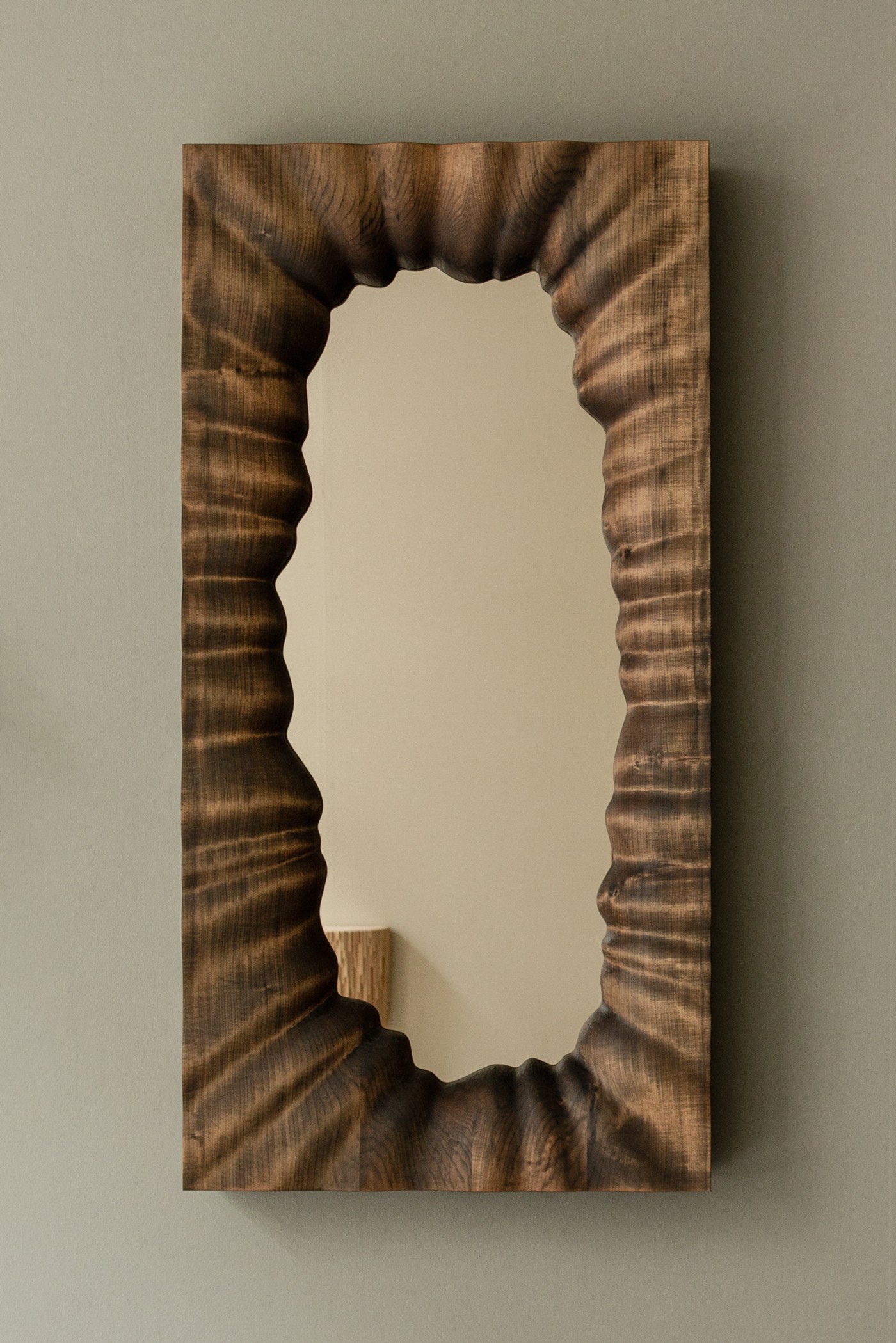 TRACES Exhibition by Antrei Hartikainen — Wooden relief panel carved with organic void creating an irregular rectangular aperture.