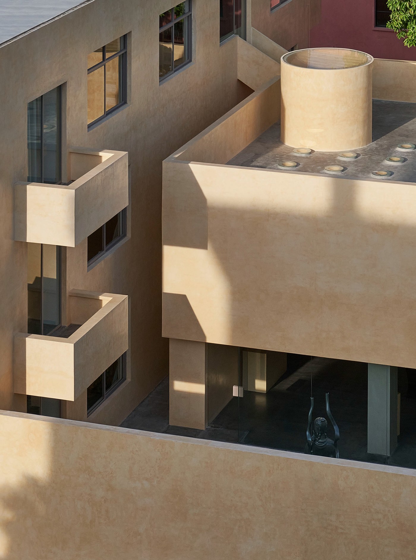 'The Field' by TEAM_BLDG by TEAM BLDG — A multi-story courtyard elevation reveals stacked voids with cantilevered concrete beams creating compressed spatial sequences.
