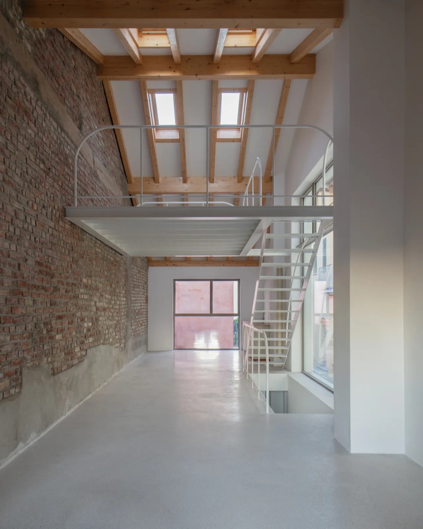 '009_Blue Bird Kitchen' by Studio Tropicana — A double-height interior void at '009_Blue Bird Kitchen' reveals the structural skeleton of adaptive reuse.