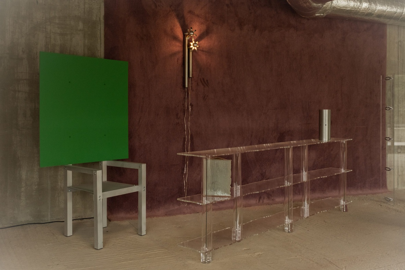 Forma - Nomad Gallery in Berlin by Forma Gallery — Forma Gallery's nomadic Berlin space stages a minimalist design installation featuring a burgundy-rendered accent wall and modular furniture.