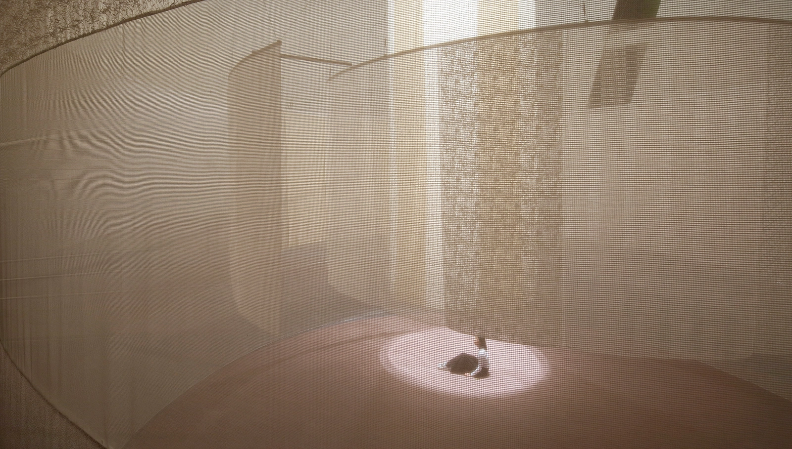 Three Tones at Spiral Garden by Isaku Design + Tashiro Design — A curved cylindrical gallery interior showcasing suspended textile panels.
