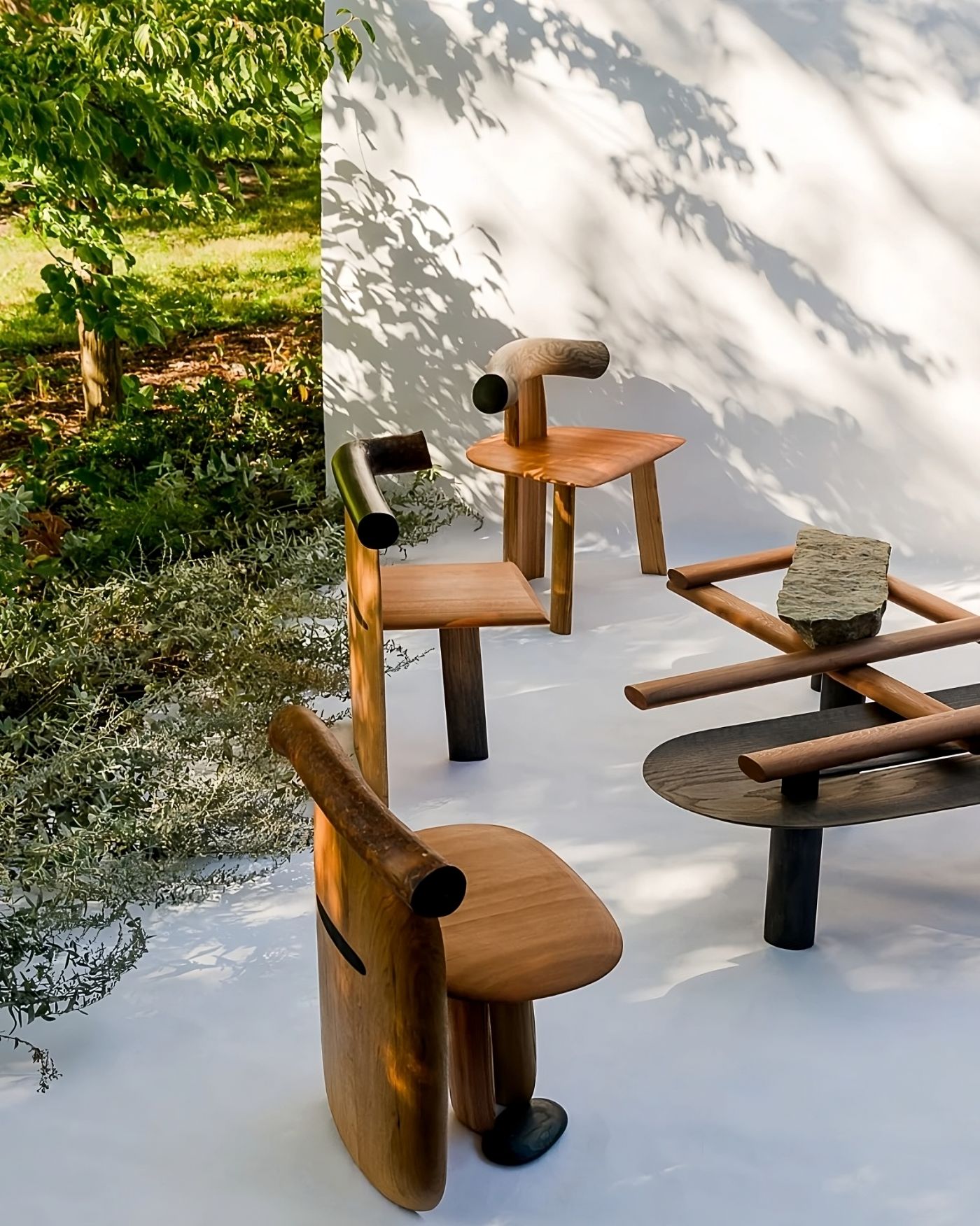 Selected 'Kanna' works by Studiovoll — Studiovoll's Kanna furniture series displayed in natural light, casting geometric shadows across a white surface.