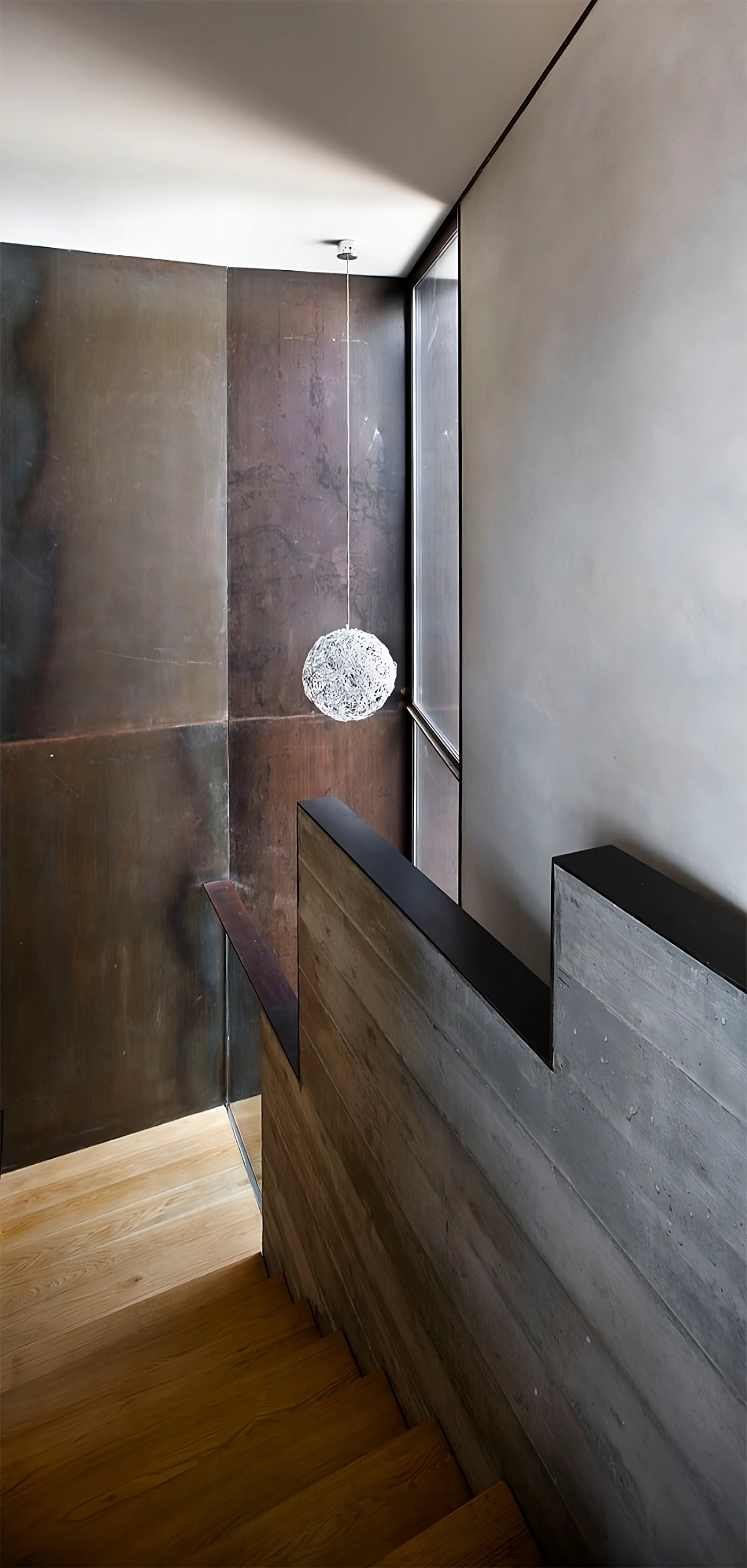 Alemenys 5 by Anna Noguera — A sectional view of the dual staircase within Alemanys 5 reveals the restoration's material hierarchy.