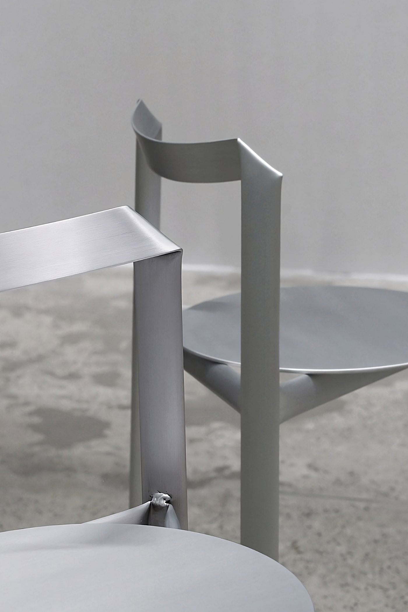 MONOCHROME by Ximi Li — A close-up detail of MONOCHROME's aluminum furniture reveals the geometric precision and material authenticity central to Ximi Li's practice.