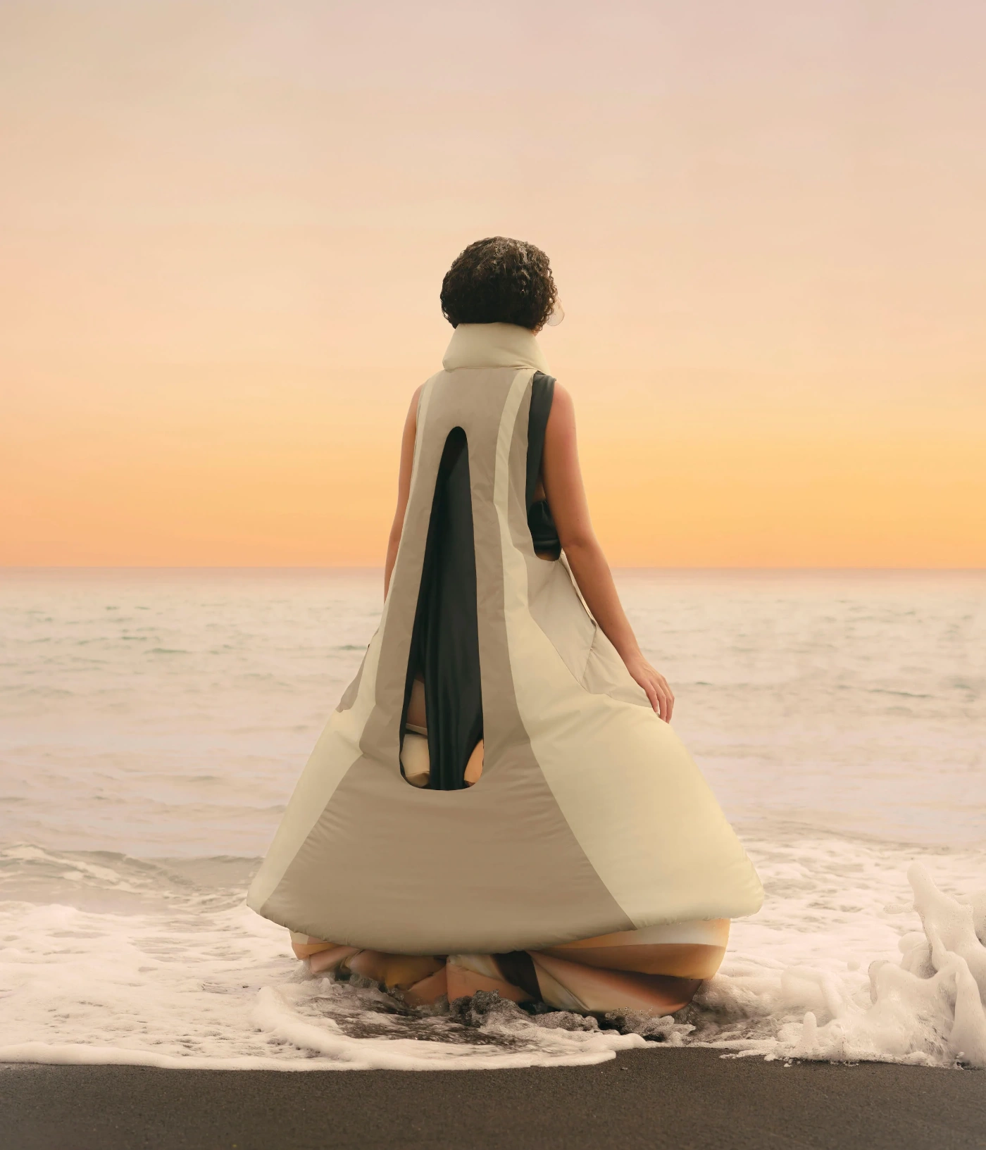 'Terranova' Graduate Collection by Izzy Du — Du's Terranova collection debuts through a sculptural cream linen garment photographed in shallow surf at golden-hour.